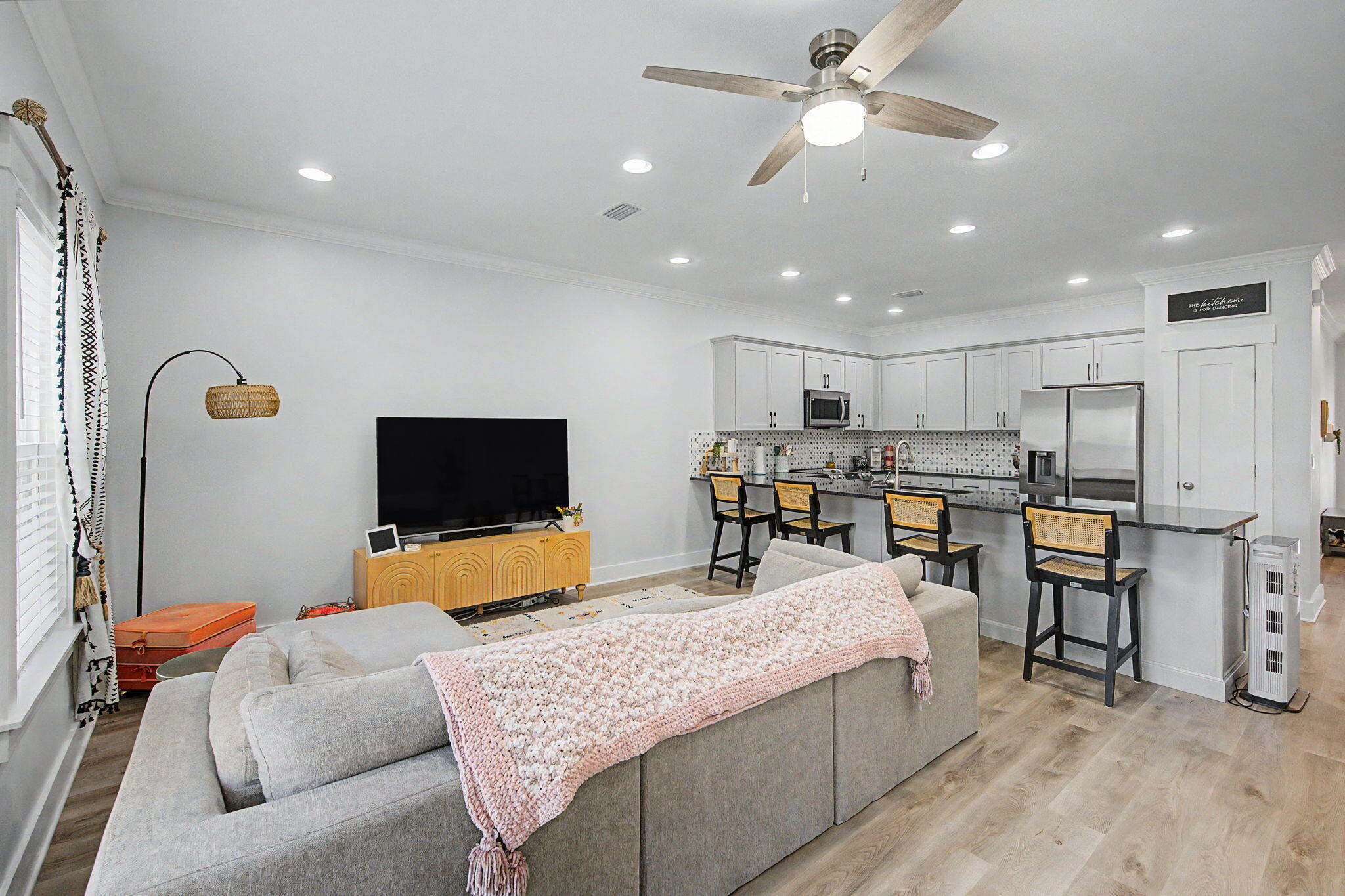 This beautifully maintained, nearly new 4-bedroom, 2.5-bath townhome offers the perfect blend of space, style, and convenience. Built just two years ago and cared for by its original owner, the home features a bright, open-concept layout with a spacious kitchen, living, and dining area--ideal for both everyday living and entertaining. Downstairs showcases durable luxury vinyl plank flooring and includes a convenient half bath, while upstairs you'll find four generously sized bedrooms and two full baths, with one bedroom offering flexibility as a home office or playroom. The upstairs laundry room adds everyday ease, and the private yard provides a great outdoor retreat. Ideally located close to schools, shopping, the hospital, and the beautiful local beaches, this townhome is a fantastic opportunity for a first-time buyer or a growing family looking for comfort and convenience in a move-in ready home.
