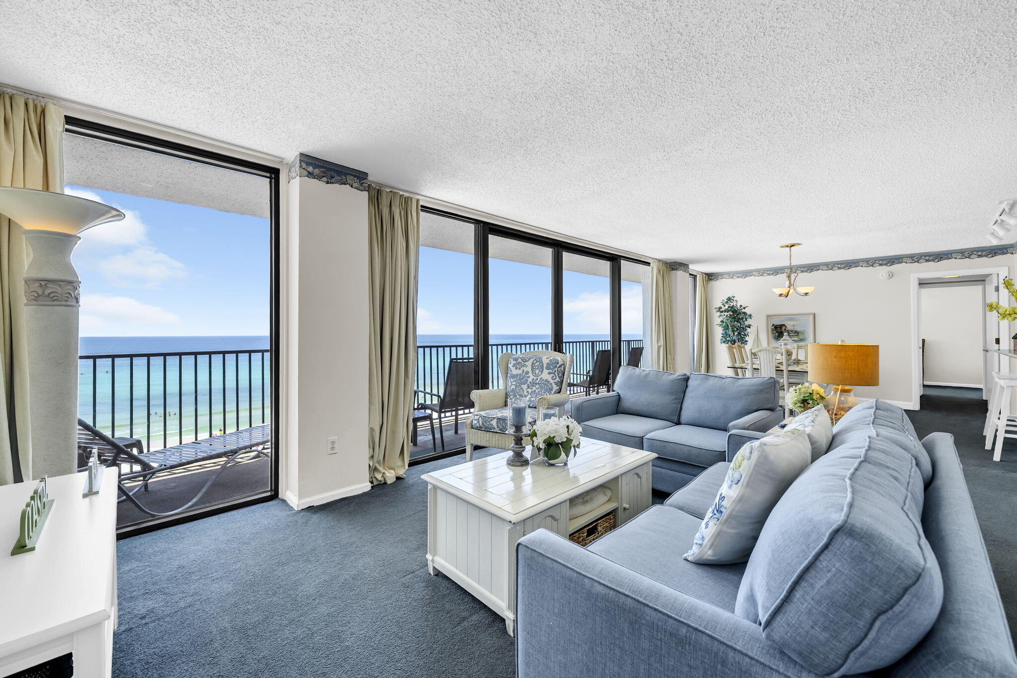 IMPRESSIVE INCOME! UNFORGETTABLE VIEWS! 14+ yrs Rental success w/$59,844 Income in 2025 & 47,380 YTD!  Even in its current condition, guests return year after year, making this an exceptional opportunity for buyers seeking IMMEDIATE INCOME w/the flexibility to update over time. Rare floor-to-ceiling windows span the entire Gulf-front side of the condo showcasing endless emerald waters & BOTH BEDROOM'S ARE GULF FRONT, allowing you to wake up to spectacular Gulf views! With Gulf vistas from nearly every room, this condo offers a beachfront experience that few condos can match. Enjoy the expansive 30+ ft balcony--perfect for morning coffee, afternoon relaxation, or watching unforgettable sunsets while listening to the waves.  VALUE is another standout. Priced well below the most recent sale in the building at 570K & below a pending unit at 550K It's a rare chance to purchase a Gulf-front condo w/proven rental performance at a compelling price.  Buy w/confidence knowing the complex has passed its Milestone Inspection, w/the exterior, Gulf-front pool & HOA reserves all in excellent condition.  Perfectly positioned in a low-density community, enjoy a quieter stretch of beach while remaining just 10 min from Pier Park & 15 min from the restaurants & coastal charm of Rosemary Bch. If you've been waiting for a Gulf-front property w/proven rental performance, unforgettable views, outstanding value & the opportunity to add your own personal style, you've found it.