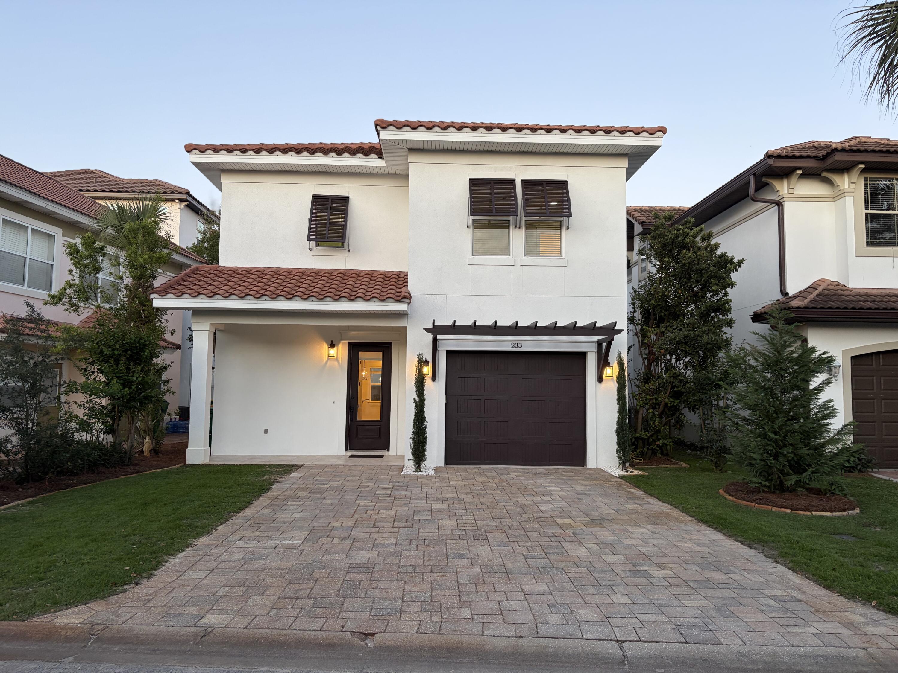 This beautifully designed Gulf Power EarthCents® certified Tuscany Coastal Home blends Mediterranean elegance with modern energy efficiency less than a mile from Destin's world-famous sugar-white beaches and emerald waters. Enjoy a healthy, active coastal lifestyle near boating, paddleboarding, golf, shopping, dining, and entertainment. Energy-saving features include a Trane 14 SEER HVAC with Nexia Home Intelligence, impact-resistant Low-E PGT windows, Frigidaire Gallery appliances, and a GE GeoSpring Hybrid water heater. Located in the gated Calusa Bay community with a resort-style pool, bathhouse, and low HOA fees of only $230 quarterly, this home is ideal as a primary residence, vacation retreat, or investment property near Destin Commons and the Emerald Coast's best attractions.