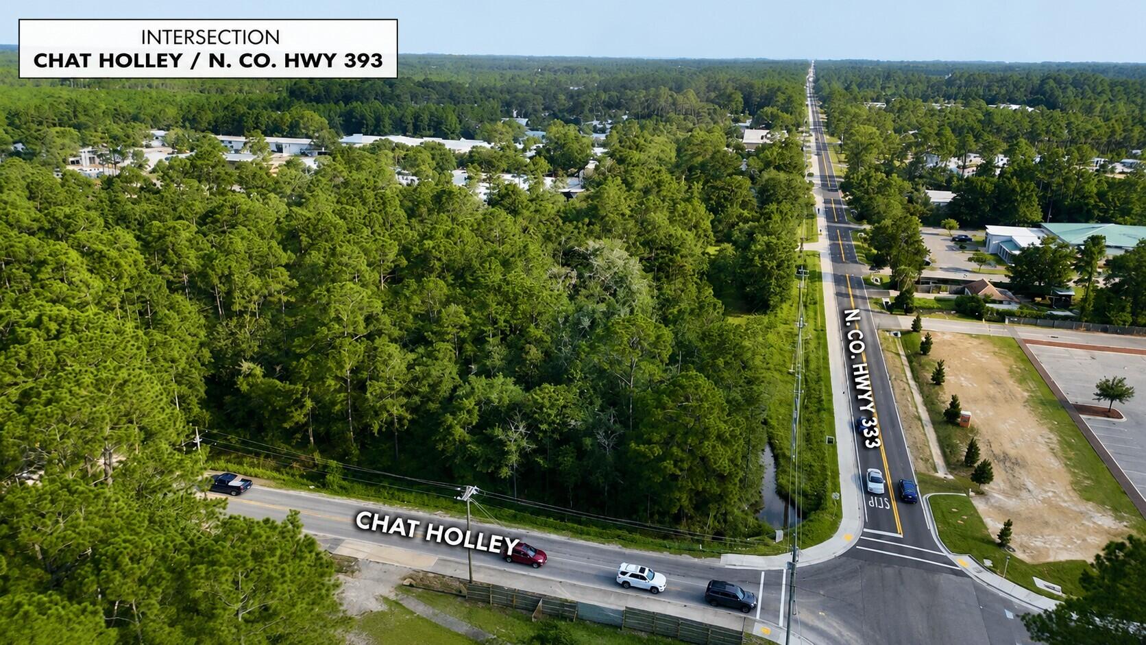 Positioned at the gateway to one of South Walton's most transformative growth corridors, this premier 8.84-acre corner parcel presents an exceptional opportunity to invest in the future of Santa Rosa Beach. 

Located at the intersection of North County Hwy 393 and Chat Holley Road, the property is strategically situated adjacent to the proposed 'Old Town of Santa Rosa' master-planned district-a 220-acre public initiative representing a significant long-term investment in regional infrastructure, recreation, and economic development. 

Momentum is already underway. Phase One infrastructure improvements have been completed with the reconstruction of County Road 393 from U.S. Highway 98 to Chat Holley Road, including enhanced regional stormwater infrastructure, water-quality improvements, a protected 6-foot sidewalk, curb and gutter enhancements, and redesigned traffic movements to improve safety and circulation. These improvements were funded through dedicated environmental grant funding, demonstrating Walton County's commitment to the continued enhancement of this corridor.

Walton County has now advanced into the next phase of the master plan, which includes a county-approved 10,000-seat outdoor event pavilion, expanded parks and trail systems, regional stormwater facilities, and future roadway connections linking Chat Holley Road directly to U.S. Highway 98 through the planned extensions of Nellie Drive and Veterans Road. The overall project is being implemented through a phased, multi-year investment strategy utilizing environmental grant funding together with Tourist Development Council revenues generated from visitor accommodations, reflecting a sustained commitment to one of South Walton's fastest-growing destinations.

The property is zoned Coastal Center (CC), one of Walton County's most flexible commercial zoning classifications, allowing a broad range of mixed-use development opportunities, including medium-density residential, retail, office, restaurant, medical, service, civic, institutional, and lodging uses, subject to Walton County requirements. The site also benefits from prior development approvals for an Early Childhood Education Center, demonstrating its proven development potential. Extensive due diligence materials--including prior development plans, engineering documents, environmental reports, traffic studies, surveys, and supporting documentation--are available, providing valuable resources for future planning and entitlement efforts.

Offering approximately 1,287 feet of frontage along Chat Holley Road and 299 feet of frontage on North County Hwy 393, the parcel commands outstanding visibility and accessibility at one of South Walton's most prominent intersections, directly across from the new U.S. Post Office. Public water, sewer, natural gas, and underground utilities are available or nearby, further enhancing the site's development readiness.

As South Walton continues to experience sustained residential, commercial, and tourism growth, opportunities to acquire commercially zoned acreage adjacent to major publicly funded infrastructure projects have become increasingly rare. Whether envisioned as a mixed-use destination, neighborhood commercial center, professional or medical campus, hospitality development, educational facility, or long-term strategic land investment, this property offers the scale, flexibility, infrastructure, and location to capitalize on the continued evolution of one of Northwest Florida's most dynamic growth corridors.
