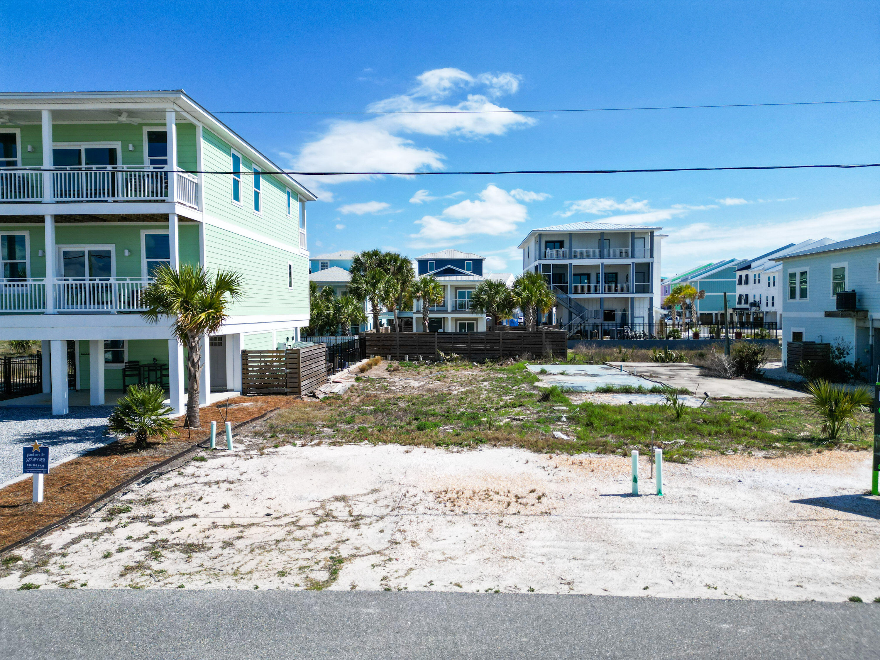 Rare opportunity to own platted lot only 400+/- feet from dedicated access to the beautiful sugar sands of one of the best shorelines in the region. Also, the parcel is located approximately 400 feet from Highway 98 which provides less traffic noise and the safety of not crossing the highway. Water and Sewer Taps Paid per owner. Owner has provided non engineered renderings of potential use, survey, and elevation certificate. Only a couple of streets over from the new municipal pier, 15 minutes from Port St. Joe, and about 15 minutes to Tyndall AFB main gate. Lot D, which is adjacent and owned by the same owner is also for sale and listed MLS #996906. All information deemed reliable but not guaranteed, please verify if important.