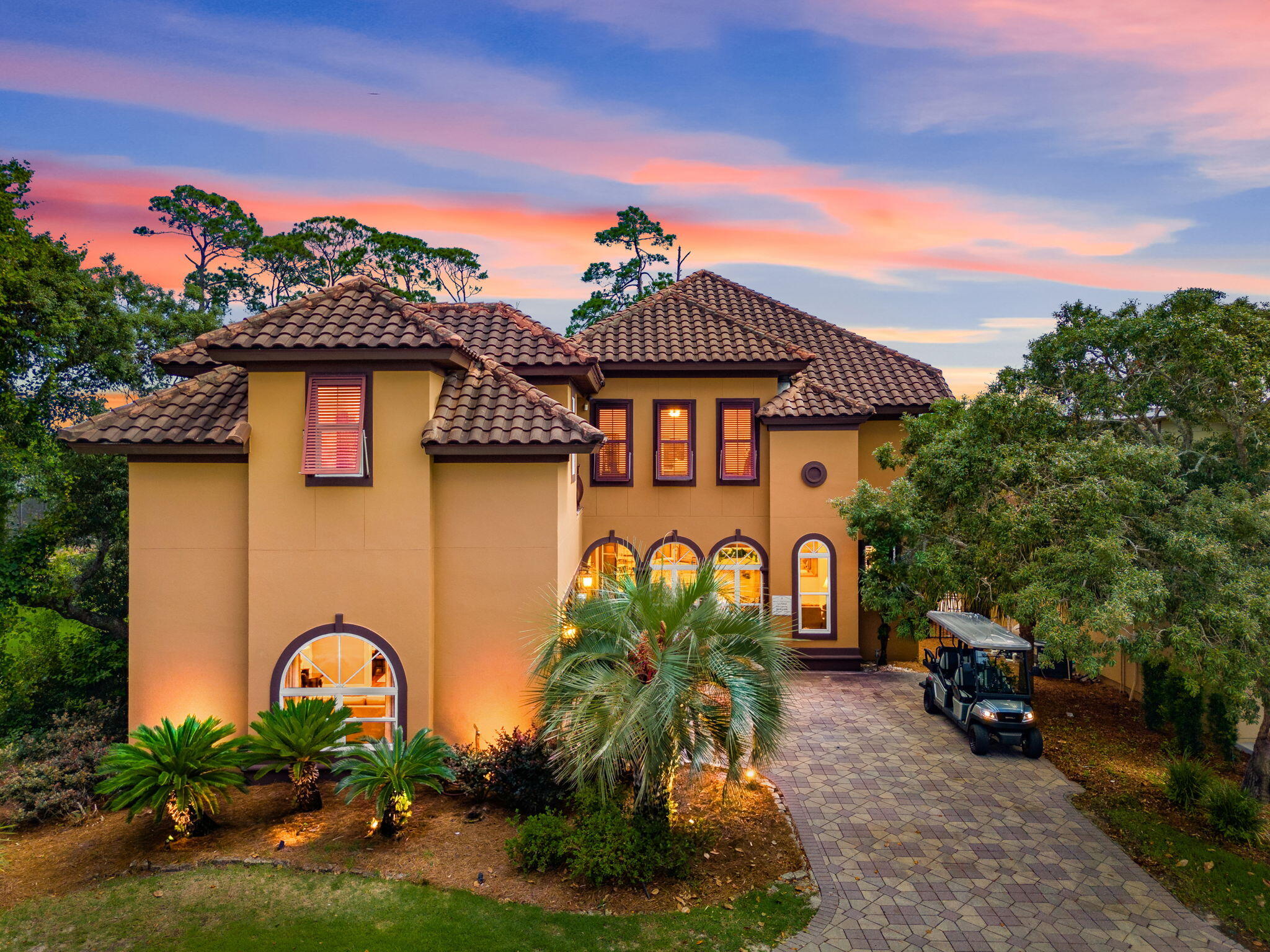 Welcome to Casa Bahari, an extraordinary luxury residence in the highly sought-after gated community of Destiny West. Designed as a private residence rather than a typical rental property, this spacious custom home offers exceptional craftsmanship, elegant finishes, and an unmatched coastal lifestyle just moments from Destin's world-famous white-sand beaches. The resort-style outdoor living area is a true showpiece, featuring a private heated pool and spa, expansive sun shelf, outdoor kitchen, bar seating, and multiple areas for relaxing and entertaining. Surrounded by lush landscaping and overlooking a tranquil nature preserve, the backyard provides the perfect setting for enjoying Florida's year-round outdoor lifestyle. Inside, the home showcases European-inspired design, a gourmet kitchen with professional-grade appliances, generous living and dining spaces, and seamless indoor-outdoor flow. Multiple gathering areas offer flexibility for entertaining family and guests. The oversized primary suite serves as a private retreat with a sitting area, wraparound balcony, spa-like bath, dual walk-in closets, and peaceful views of the preserve and community lakes. Three additional guest bedrooms provide comfortable accommodations, while the detached carriage house with kitchenette and full bath offers the ideal guest suite, home office, or private retreat. Destiny West's exclusive amenities, including a resort-style pool, tennis courts, fitness center, clubhouse & beautiful grounds