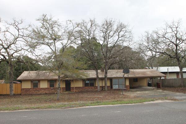 Real Estate Owned property located in growing North Crestview. This brick ranch style home offers 4 bedrooms and 3 full bathrooms and is situated on approximately 1/2 acre. The layout includes spacious living areas, a kitchen with ample cabinetry, and generously sized bedrooms. The primary bedroom features two oversized walk in closets and an additional secure interior space. Exterior features include an in ground pool and a fenced backyard with privacy fencing designed to allow airflow. Property offers country style living with no city taxes. Convenient location with easy access to shopping, schools, and major roadways. Call to take a look at 6047 Eden Square today.