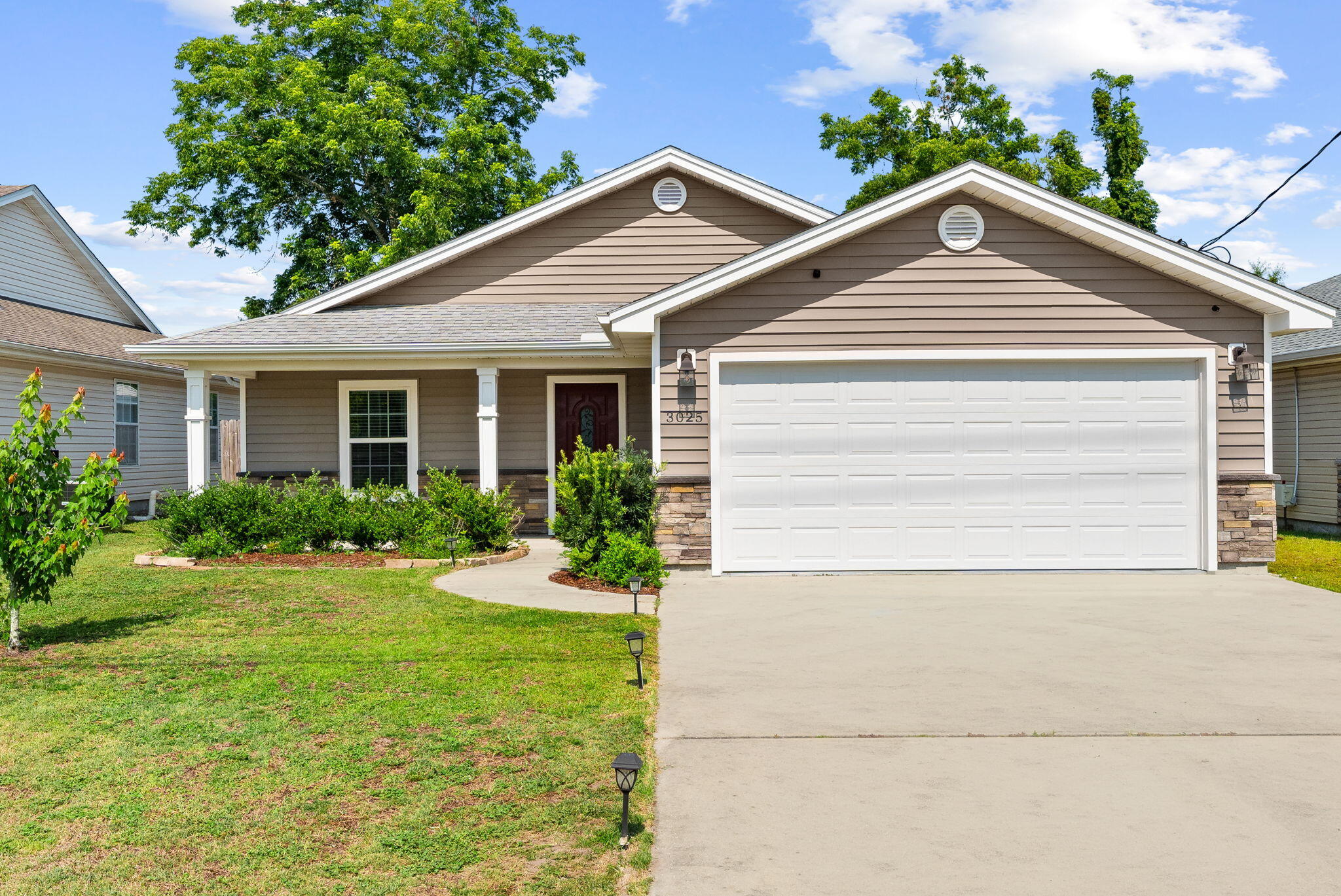 Welcome to 3025 Sarasota Avenue, a beautifully maintained 2020-built residence offering the perfect combination of modern finishes, everyday functionality, and a highly convenient Panama City location. 

Featuring 3 bedrooms, 2 bathrooms, and a desirable open-concept design, this home is ideal for first-time homebuyers, downsizers, or investors seeking a low-maintenance property in the heart of Bay County.

Inside, you'll find waterproof vinyl flooring throughout, granite countertops, and a spacious living area highlighted by a striking tray ceiling, custom shiplap accent wall, electric fireplace, and built-in entertainment center. The well-appointed kitchen offers ample workspace and storage, while the primary suite features a double vanity and private bath.

The exterior showcases attractive stone and vinyl accents that create exceptional curb appeal. Enjoy both front and rear covered porches, gutters, a fully fenced backyard with swing set, and an extended concrete patio perfect for grilling, entertaining, or relaxing outdoors. A stone paver pathway provides convenient access to the backyard, while the two-car garage adds additional storage and functionality.

Located in Flood Zone X with no HOA, this property offers added peace of mind and flexibility. Situated just minutes from everyday conveniences, you'll enjoy quick access to Publix, Winn-Dixie, Walmart, and numerous dining and shopping destinations. The home is also conveniently located near schools, parks, and major commuter routes, making daily errands and travel effortless.

Combining modern construction, thoughtful upgrades, and an exceptionally convenient central location, 3025 Sarasota Avenue presents an outstanding opportunity to own a move-in-ready home in one of Panama City's most accessible areas.