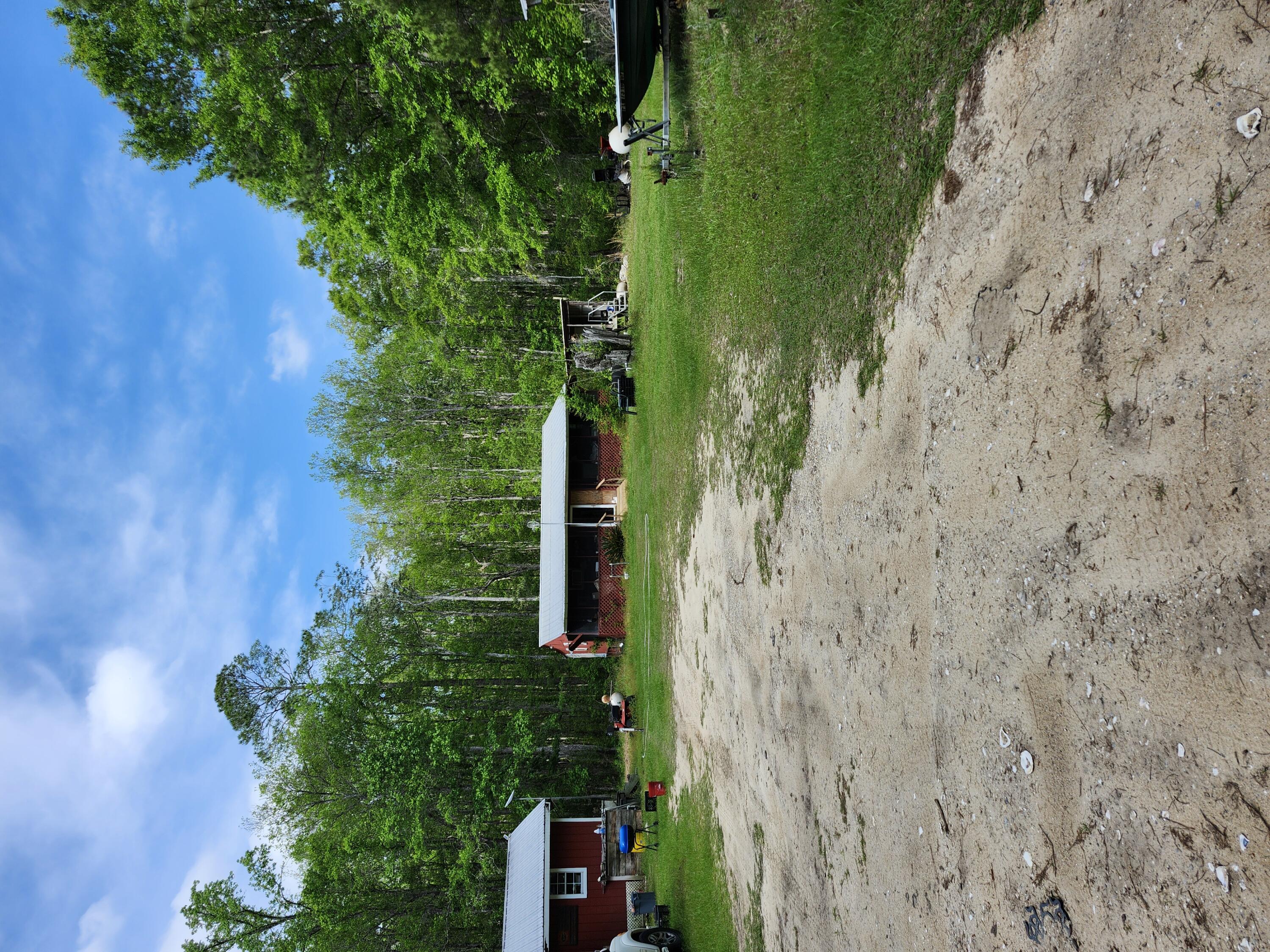 This property is only 1 turn away from the Brand New Nature View Subdivision on hwy 3280 in booming Freeport Fl. Imagine the investment opportunity owning appx 4 acres of land almost joining Nature View for this price that also joins Northwest Florida Land Management. Not to mention the Choctawhatchee River is at the end of the road featuring a nice, paved boat ramp, plenty of hunting, fishing, and privacy.  This property is being sold as VACANT LAND. The cabins are being left as a GIFT to the new buyers and are given NO VALUE. This property conveniently already has 2 power poles, a well and 2 separate addresses. Pole barn on property is of no value.