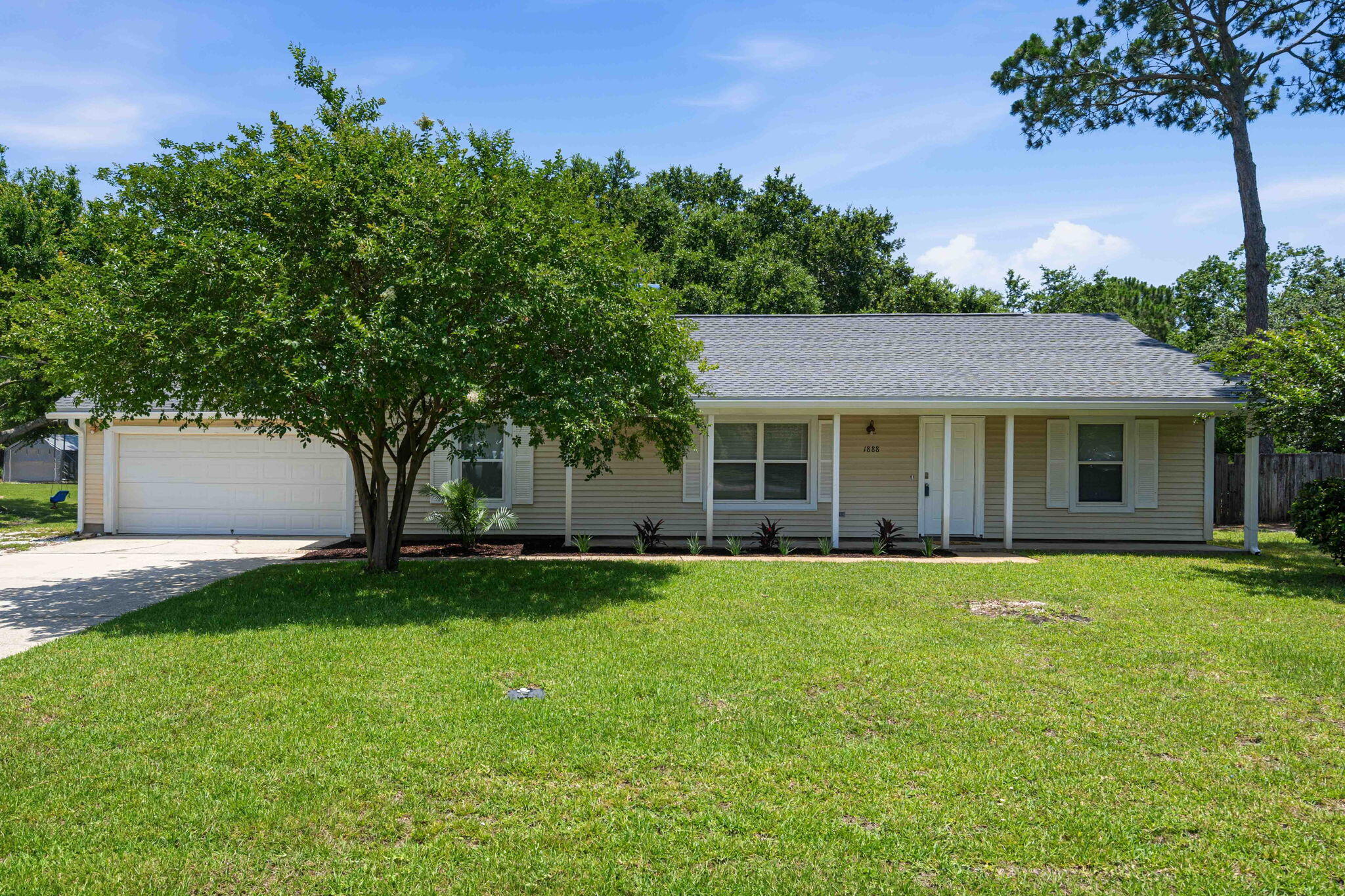 There's something special about a home with a backyard that instantly makes you exhale, and 1888 Coral Street delivers exactly that. Set beneath a canopy of mature oak trees, this 3-bedroom, 2-bath home in Holley by the Sea pairs everyday comfort with an outdoor setting that feels truly memorable. Inside, you'll find LVP flooring, neutral painted walls and a welcoming layout designed for both daily living and easy entertaining. The kitchen has been refreshed with painted grey cabinets and granite counter tops, while major system updates--including a new roof in 2023, HVAC in 2024, and water heater in 2021--add confidence where it counts. From morning coffee under the trees to evenings spent enjoying the backyard, this property offers a rare blend of charm, function, and the kind of outdoor space you'll never forget.
