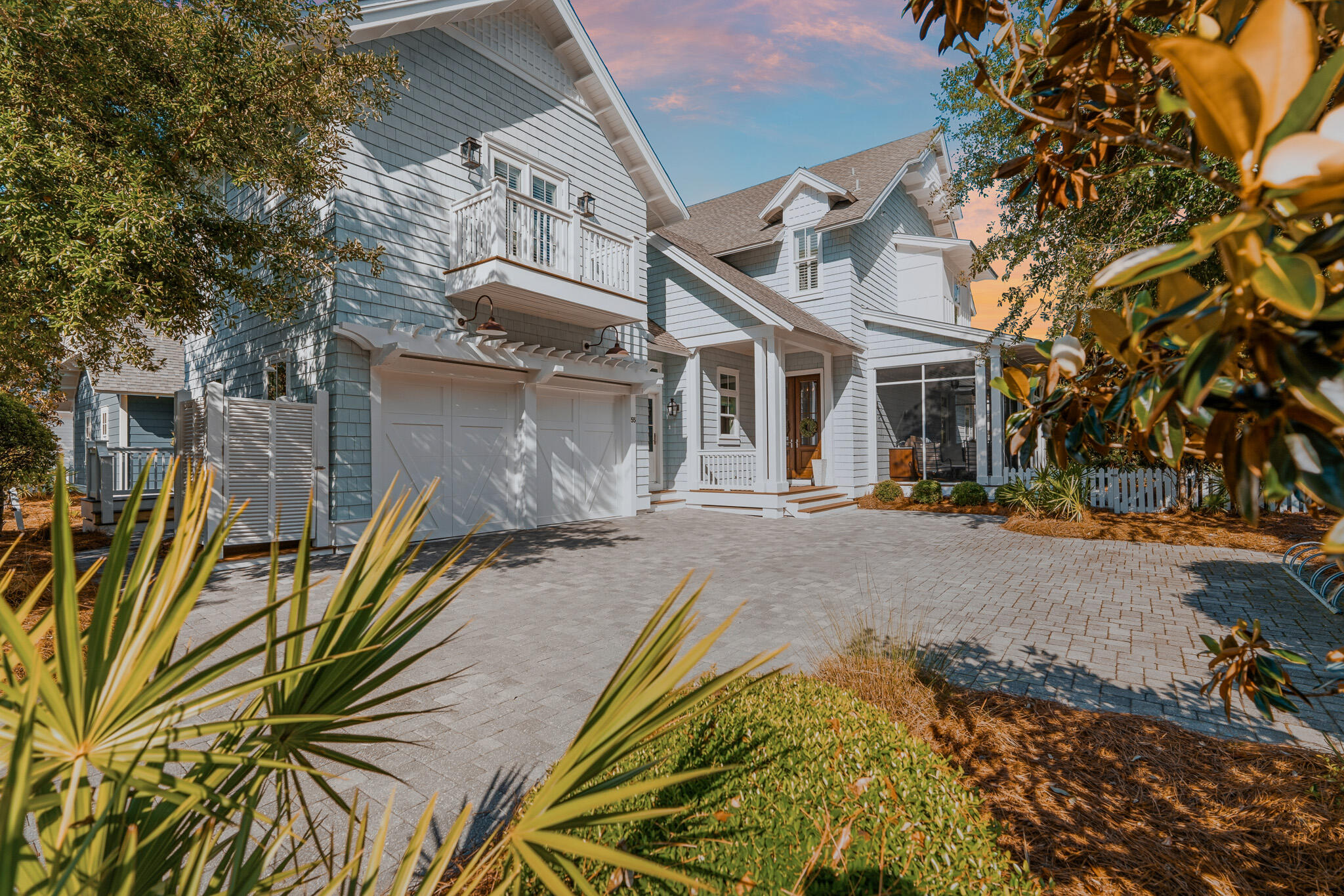 55 Half Hitch Lane is the kind of home that feels different the moment you arrive. Tucked near the back of WaterSound West Beach on a private corner lot with only a handful of homes beyond it, the setting offers a quieter and more peaceful feel that is hard to find along 30A. Built by Regal Stephens in 2015, the home was thoughtfully designed to truly live in and enjoy.
Spanning approximately 3,467 square feet, the property features 5 bedrooms, 5.5 bathrooms, a bunk room, an upstairs secondary living area, and a fully functional carriage house complete with its own entrance, kitchen, and laundry, creating an ideal setup for guests, grandparents, or extended family stays.
Inside, the home blends timeless coastal design with warm and comfortable living spaces. White oak floors, vaulted wood beam ceilings, marble countertops, and Wolf and Sub Zero appliances all come together in a way that feels elevated yet relaxed. The kitchen, dining, and living spaces flow naturally together and open seamlessly onto screened porches and outdoor living areas complete with a gas fireplace and outdoor kitchen.
The homesite itself is one of the standout features of the property. The garage was intentionally positioned on the opposite side of the home, creating a more open feel with additional yard space, privacy, and an impressive amount of parking rarely found in the neighborhood. There is also room to add a private pool if desired. Located less than a few minute stroll from the private beach boardwalk and community pool, the home offers access to one of the most beautiful stretches of beach along 30A while still maintaining a calm and tucked away feel within the community.

Whether used as a full time residence, second home, or investment property, 55 Half Hitch Lane offers a rare combination of warmth, privacy, thoughtful design, and livability that is becoming harder and harder to find along 30A.