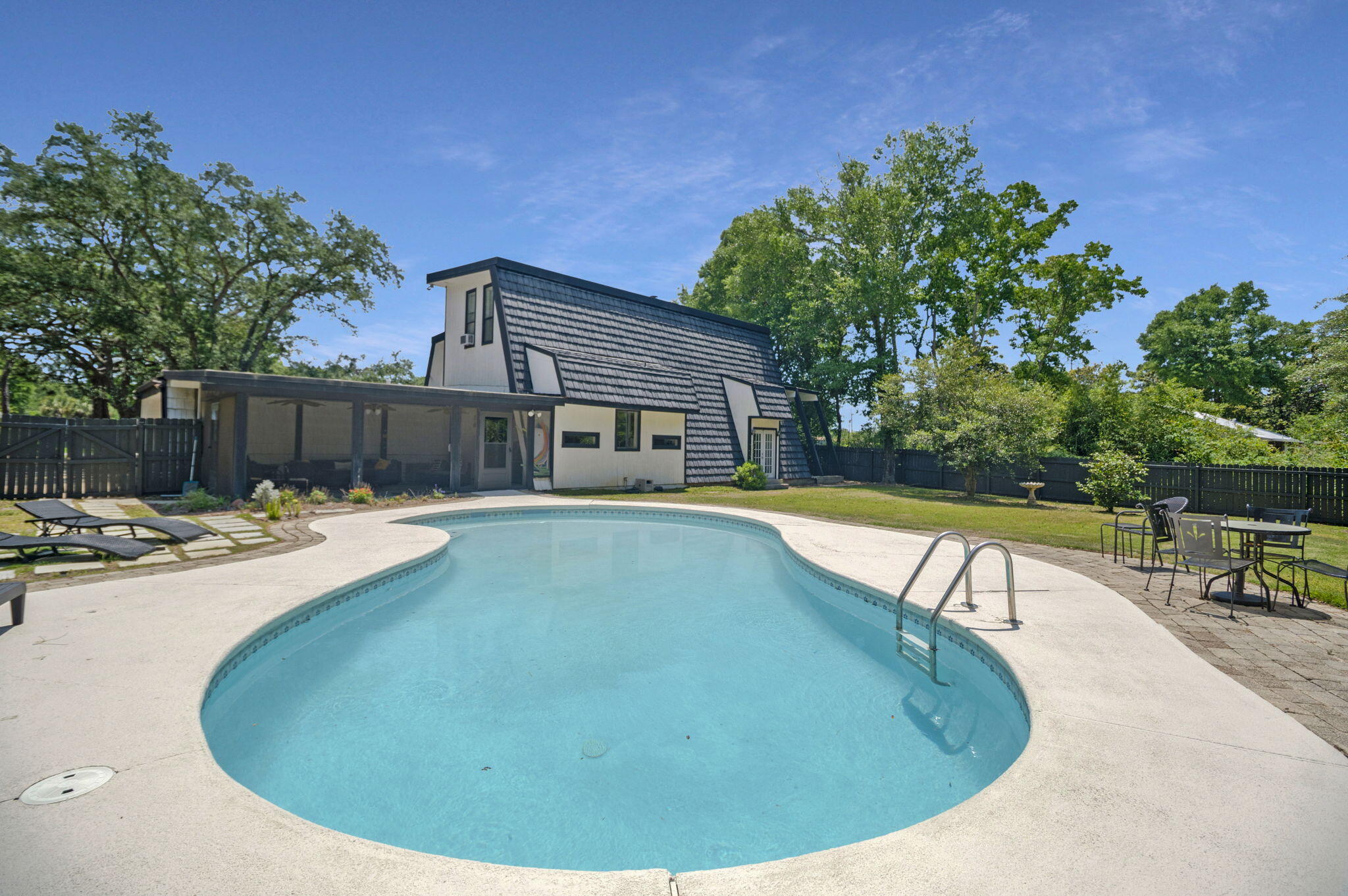 Rarely does a property offer this combination of scale, luxury, and location. Set on over an acre of lush, private land just minutes from the sugar-white sands of Navarre Beach, this stunning three-level home delivers nearly 4,000 square feet of thoughtfully designed living space.
Three expansive levels provide the space and flexibility that families, entertainers, and savvy investors dream of - with room for everyone to spread out and unwind. The chef's kitchen is the heart of the home, outfitted for serious cooking, effortless entertaining, and generous workspace that will satisfy even the most discerning culinary enthusiast.
Step outside and discover your own private resort. A large outdoor patio sets the stage for al fresco dining, sunset gatherings, and leisurely afternoons centered around a beautiful pool enclosed by lush, mature landscaping. The fully fenced backyard delivers serious privacy and tranquility.
Location is everything, and this property delivers. Navarre Beach -- consistently ranked among Florida's most beautiful and uncrowded stretches of coastline -- is just minutes away, putting world-class sand and emerald water at your fingertips.
This home also comes with a track record of operating as an income-generating STR, it's turnkey and ready to keep producing revenue from day one. 
Whether you're seeking a smart investment, a forever home, or the perfect blend of both, this is a rare opportunity on the Emerald Coast.