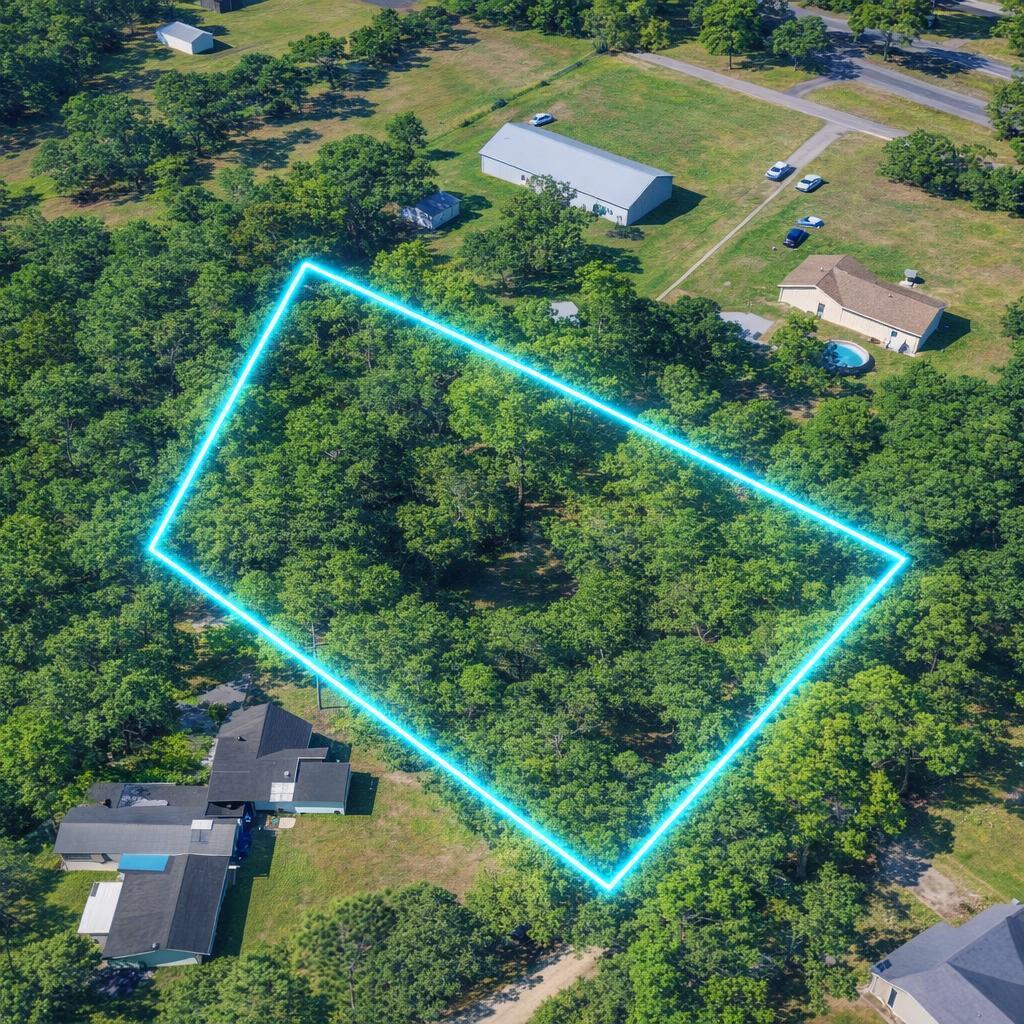 Coastal Living Meets Neighborhood Charm
Discover the perfect canvas for your coastal retreat on this expansive 0.72-acre rectangular lot. Nestled within the serene, established community of Perdido Manor, this beautifully wooded property places you just steps from the pristine waters of Perdido Bay and within walking distance of the Perdido Bay Bridge. Whether you're looking for a short commute to NAS Pensacola and Corey Station or a quick 25-minute drive into the heart of Downtown Pensacola, this location offers the ideal balance of tranquility and accessibility. Zoned for single-family residential use, the property is perfectly suited for building your dream home, designing a Florida vacation getaway, creating a peaceful retirement haven, or securing a smart Gulf Coast investment. Enjoy the natural privacy provided by mature trees while still being minutes from world-class beaches, fishing, boating, and the vibrant Pensacola dining and entertainment scene. Build your dream home where the bay breeze is a daily luxury. Easement to the property from Serenity Circle.