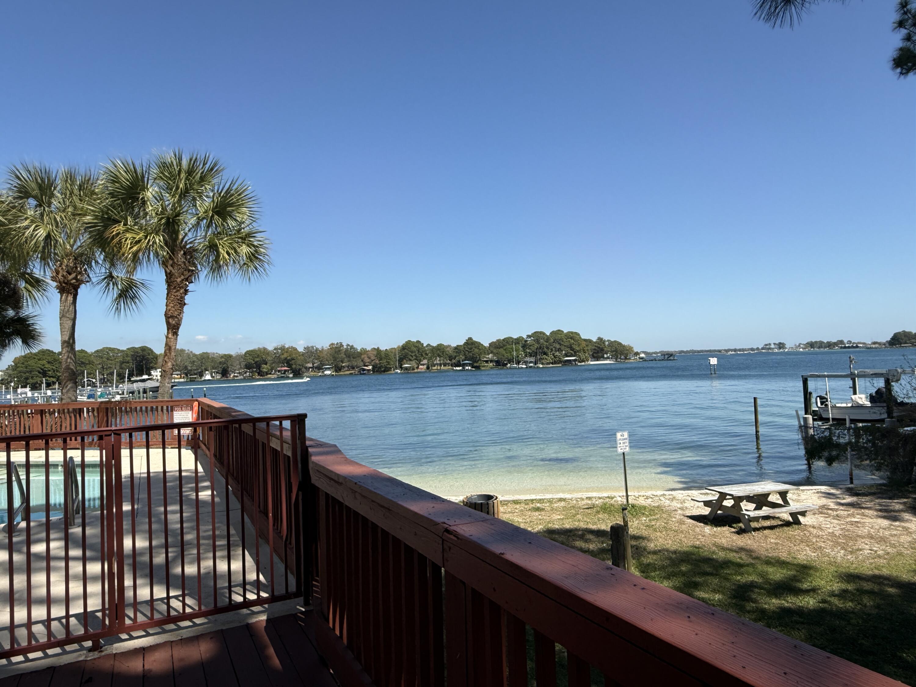 Wake up to peaceful sunrises and stunning water views every day in this beautifully maintained 2-bedroom, 2-bathroom waterfront condo nestled along Cinco Bayou in Fort Walton Beach. Offering a perfect balance of comfort and coastal charm, this home is ideal for those seeking a relaxing primary residence or a serene getaway.

Step inside to a bright and open living space with attractive flooring and large windows that fill the home with natural light while showcasing the tranquil waterfront scenery. The adjoining dining area creates a welcoming space for meals and gatherings, flowing seamlessly from the living room into the well-appointed kitchen. The kitchen features granite countertops, ample cabinet storage, a pantry, and modern stainless steel appliances, making it both functional and stylish. A convenient laundry room is located just off the kitchen for added ease.

The bedrooms are generously sized and designed for comfort. One of the bedrooms offers beautiful waterfront views along with a spacious walk-in closet, creating a peaceful retreat to unwind at the end of the day. Both bathrooms are clean, well-maintained, and thoughtfully laid out to accommodate everyday living.

Step outside to your private balcony to enjoy your morning coffee or evening sunsets, or take advantage of the direct water access just steps away. The unit is ideally located right next to the waterfront community pool, offering both convenience and a resort-style feel. For boating enthusiasts, a boat slip and lift are available for an additional $125 per month, making it easy to spend weekends at Crab Island or enjoy fishing right in your backyard.

Situated in a well-maintained community, this condo is perfectly located close to beaches, military bases, restaurants, shopping, schools, and more--giving you easy access to everything Fort Walton Beach has to offer while still enjoying peaceful waterfront living. Whether you're looking for tranquility or year-round coastal lifestyle, this property truly offers the best of both worlds.

Pets may be considered on a case-by-case basis with prior owner approval and a non-refundable pet fee. Smoking and vaping are not permitted inside the home.