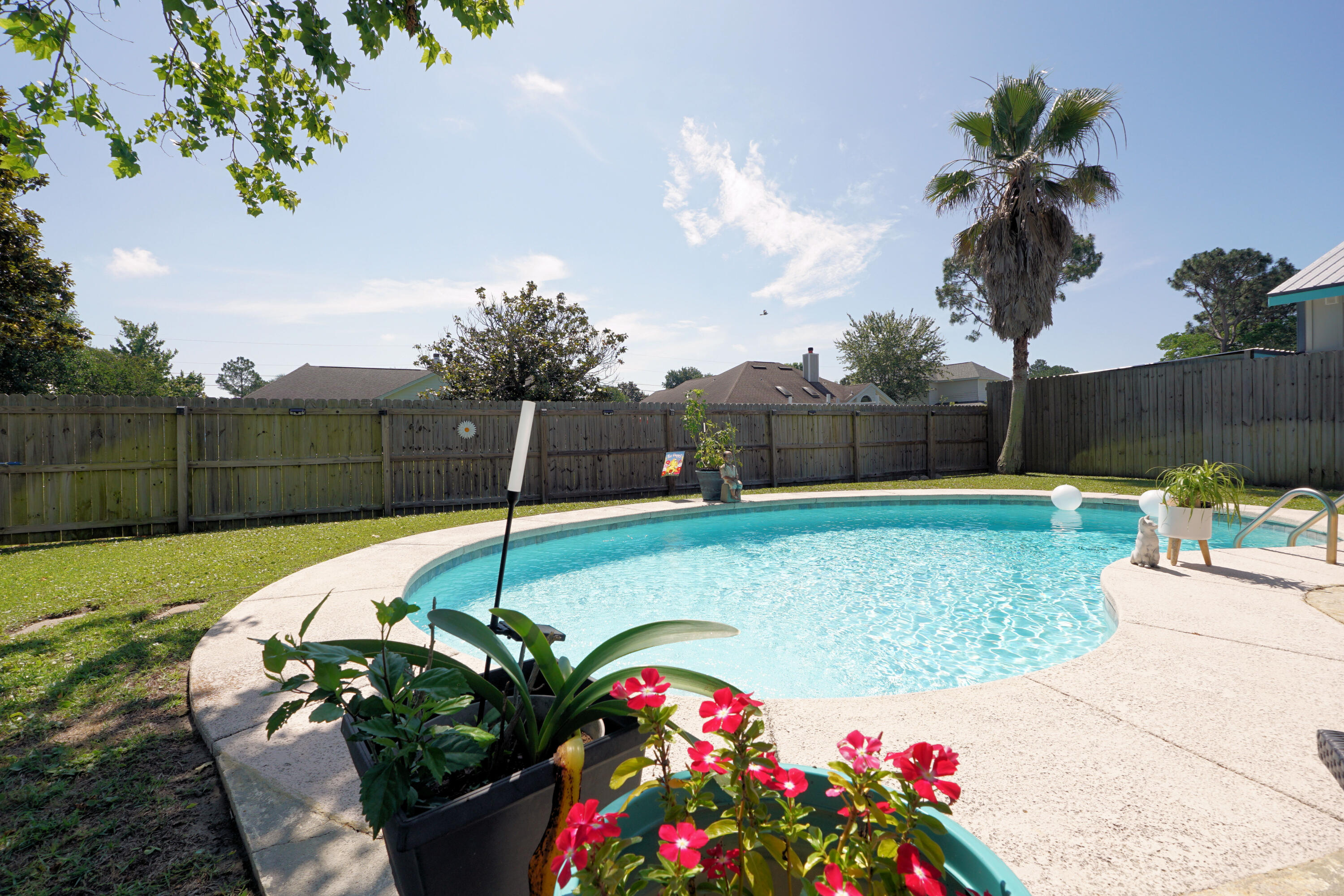 Adorable Florida Cottage. Within minutes of the Navarre Beach Bridge. East Navarre location makes this Pool Home convenient to HURLBURT FIELD, grocery shopping, restaurants and all Navarre has to offer. Seller has lovingly maintained and updated this home to include new roof June 2021, new windows throughout May 2021, new fence July 2021, new water heater 2020. Kitchen has lovely granite counters and tile backsplash. Seller installed gas line to accommodate a Gas Range and included a gas stub for grill. Both bathrooms have been beautifully remodeled. Gorgeous park-like backyard invites you to relax under the shade tree while keeping an eye on the in-ground pool occupants. Wooden back deck for alfresco dining was just redone. Large shed for mower and pool toys. Could be converted to a Man Cave or She Shed! High yield Peach Tree provides delicious peaches! Natural blackberries too. Established neighborhood with sidewalks. What an awesome place to call Home! No restrictions so could also be used as an Airbnb. See it today!