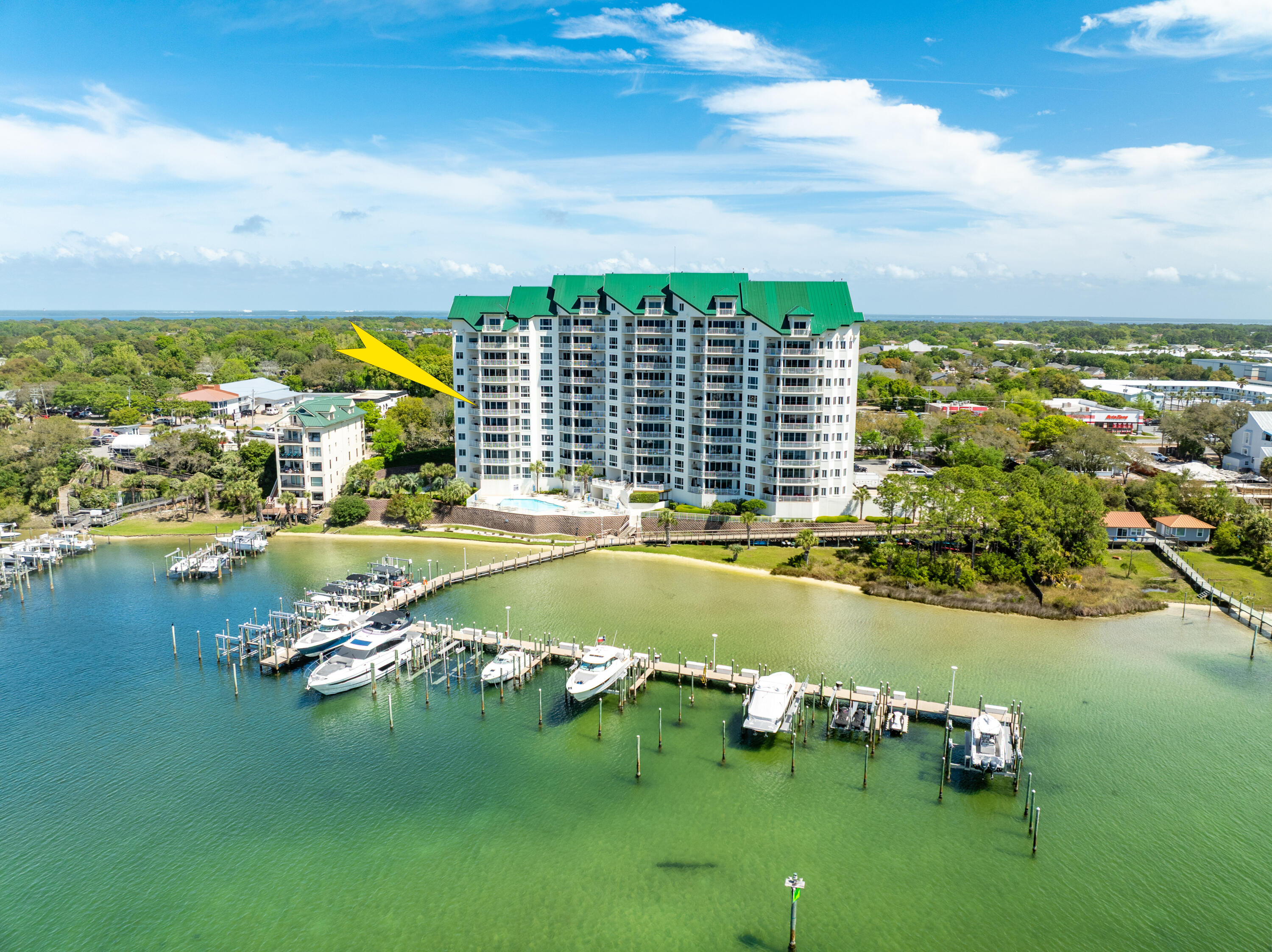 LIST PRICE REDUCED! POTENTIAL ASSUMABLE MORTGAGE at 2.75%.  Grand Harbor represents one of the most exclusive addresses on the scenic harbor of Destin, Florida.  This 5th floor villa offers an extraordinary view corridor (enjoyed throughout much of the interior, as well as from its expansive balcony oriented to the West) to the Gulf of America, as well as the East Pass and Choctawhatchee Bay.  This premier 4-bedroom, 4- bathroom, approximate 2,995 square feet lives more like a house floor plan and less like a condominium, yet the ownership has the luxury of onsite maintenance and management to focus their well-deserved time enjoying the phenomenal local lifestyle, and perhaps... peace of mind amid periods of travel.  The amenities of Grand Harbor include a garage, guest suite, and a gorgeous club room, as well as a pool, hot tub, and other desirable exterior features, most all of which have been updated within recent years.  The delineated dog park, exclusive to ownership, is also an exceptional asset to enjoy with your dog around the tranquil harbor setting of Grand Harbor.  Please inquire for further details.