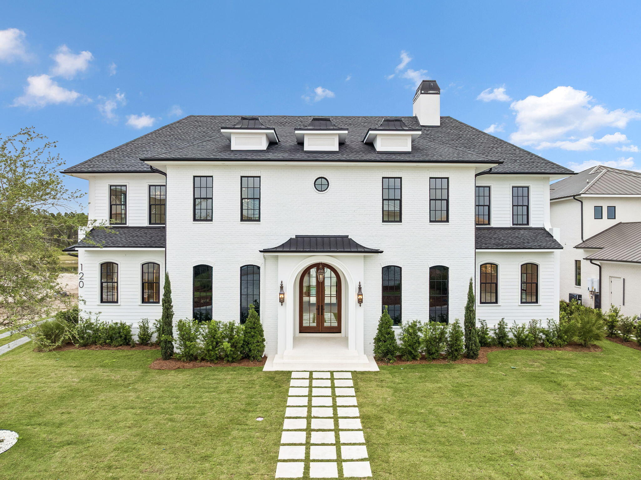 Discover refined coastal living in this stunning custom-designed home, offering over 6,000 square feet with 6 bedrooms in the main residence, a carriage house,  and private pool located in the exclusive WaterSound Camp Creek community.   Every detail of this residence combines timeless architecture with luxurious modern amenities.
The first floor welcomes you with a grand vaulted foyer that opens to an expansive living and dining area anchored by a brick fireplace and exposed distressed wood beams. The gourmet kitchen is a chef's dream--featuring a 60'' gas range, oversized island, ice maker, and a walk-in pantry with built-in shelving. A nearby coffee bar and wine cooler make entertaining effortless. The primary suite on the main level is a serene retreat, boasting a king-sized layout, a spa-inspired bath with a curbless shower, 6-foot soaking tub, and dual vanities. A large custom closet completes the suite. The first floor also includes a guest bedroom with ensuite bath, powder room, and a laundry/mudroom with direct garage access. Step outside to a private outdoor living area with a vaulted ceiling, outdoor kitchen, and resort-style pool with a water feature perfect for relaxing or hosting gatherings.
The second floor offers four spacious king bedrooms, each with ensuite baths, built-in desks, and custom closets. A media/TV room provides a cozy spot for entertainment or family relaxation. Elegant plaster arches, shiplap siding, and detailed millwork add warmth and sophistication throughout. Above the garage, a private carriage suite offers full guest accommodations, including a bedroom, bath, living area, and fully equipped kitchenette ideal for visitors.
Nestled between Scenic Highway 30A and Highway 98, WaterSound Camp Creek provides effortless access to the vibrant hubs of Alys and Rosemary Beach, as well as an array of top-tier dining and entertainment options synonymous with the 30A lifestyle. Directly adjacent to the Camp Creek entrance lies the bustling WaterSound Town Center, which plays host to a variety of events such as a weekly Farmer's Market, and is home to an array of storefronts including Publix, multiple dining establishments, a STEAM school campus, and medical facilities.
Additionally, the property includes a WaterSound Clubs Lifestyle Membership, granting privileges to the private beach club and exclusive access to premier golf courses such as Camp Creek, Sharks Tooth, Origins, and the forthcoming Davis Love course in the vicinity.
Don't miss the opportunity to delve deeper into the allure of WaterSound Camp Creek, a highly coveted destination for both permanent and seasonal residents along 30A. Contact us today to uncover more about this exceptional offering.