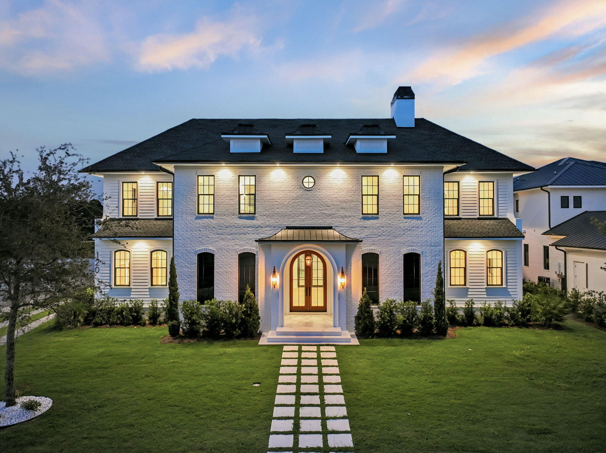 Discover refined coastal living in this stunning custom-designed home, offering over 6,000 square feet with 6 bedrooms in the main residence, a carriage house,  and private pool located in the exclusive WaterSound Camp Creek community.   Every detail of this residence combines timeless architecture with luxurious modern amenities.
The first floor welcomes you with a grand vaulted foyer that opens to an expansive living and dining area anchored by a brick fireplace and exposed distressed wood beams. The gourmet kitchen is a chef's dream--featuring a 60'' gas range, oversized island, ice maker, and a walk-in pantry with built-in shelving. A nearby coffee bar and wine cooler make entertaining effortless. The primary suite on the main level is a serene retreat, boasting a king-sized layout, a spa-inspired bath with a curbless shower, 6-foot soaking tub, and dual vanities. A large custom closet completes the suite. The first floor also includes a guest bedroom with ensuite bath, powder room, and a laundry/mudroom with direct garage access. Step outside to a private outdoor living area with a vaulted ceiling, outdoor kitchen, and resort-style pool with a water feature perfect for relaxing or hosting gatherings.
The second floor offers four spacious king bedrooms, each with ensuite baths, built-in desks, and custom closets. A media/TV room provides a cozy spot for entertainment or family relaxation. Elegant plaster arches, shiplap siding, and detailed millwork add warmth and sophistication throughout. Above the garage, a private carriage suite offers full guest accommodations, including a bedroom, bath, living area, and fully equipped kitchenette ideal for visitors.
Nestled between Scenic Highway 30A and Highway 98, WaterSound Camp Creek provides effortless access to the vibrant hubs of Alys and Rosemary Beach, as well as an array of top-tier dining and entertainment options synonymous with the 30A lifestyle. Directly adjacent to the Camp Creek entrance lies the bustling WaterSound Town Center, which plays host to a variety of events such as a weekly Farmer's Market, and is home to an array of storefronts including Publix, multiple dining establishments, a STEAM school campus, and medical facilities.
Additionally, the property includes a WaterSound Clubs Lifestyle Membership, granting privileges to the private beach club and exclusive access to premier golf courses such as Camp Creek, Sharks Tooth, Origins, and the forthcoming Davis Love course in the vicinity.
Don't miss the opportunity to delve deeper into the allure of WaterSound Camp Creek, a highly coveted destination for both permanent and seasonal residents along 30A. Contact us today to uncover more about this exceptional offering.