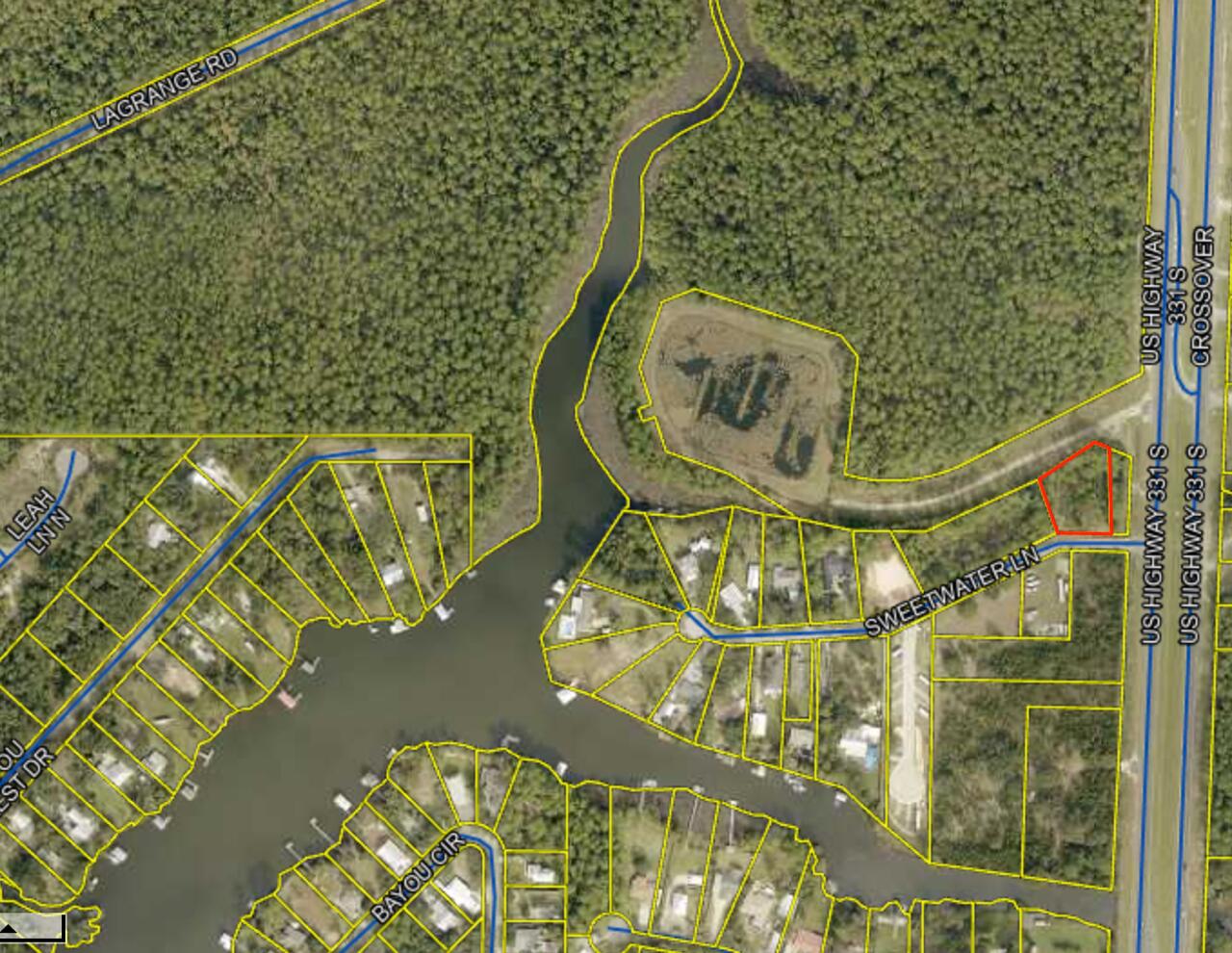 Large lot located conveniently to beaches of South Walton , Choctawhatchee Bay and Freeport . Lot is over .5 acres and has been cleared. A 15 foot public access to bayou is across street offering great access to water. Quiet neighborhood with NO HOA.  The property does have approved plans available for purchase. Please inquire on property plans and possible build out options.