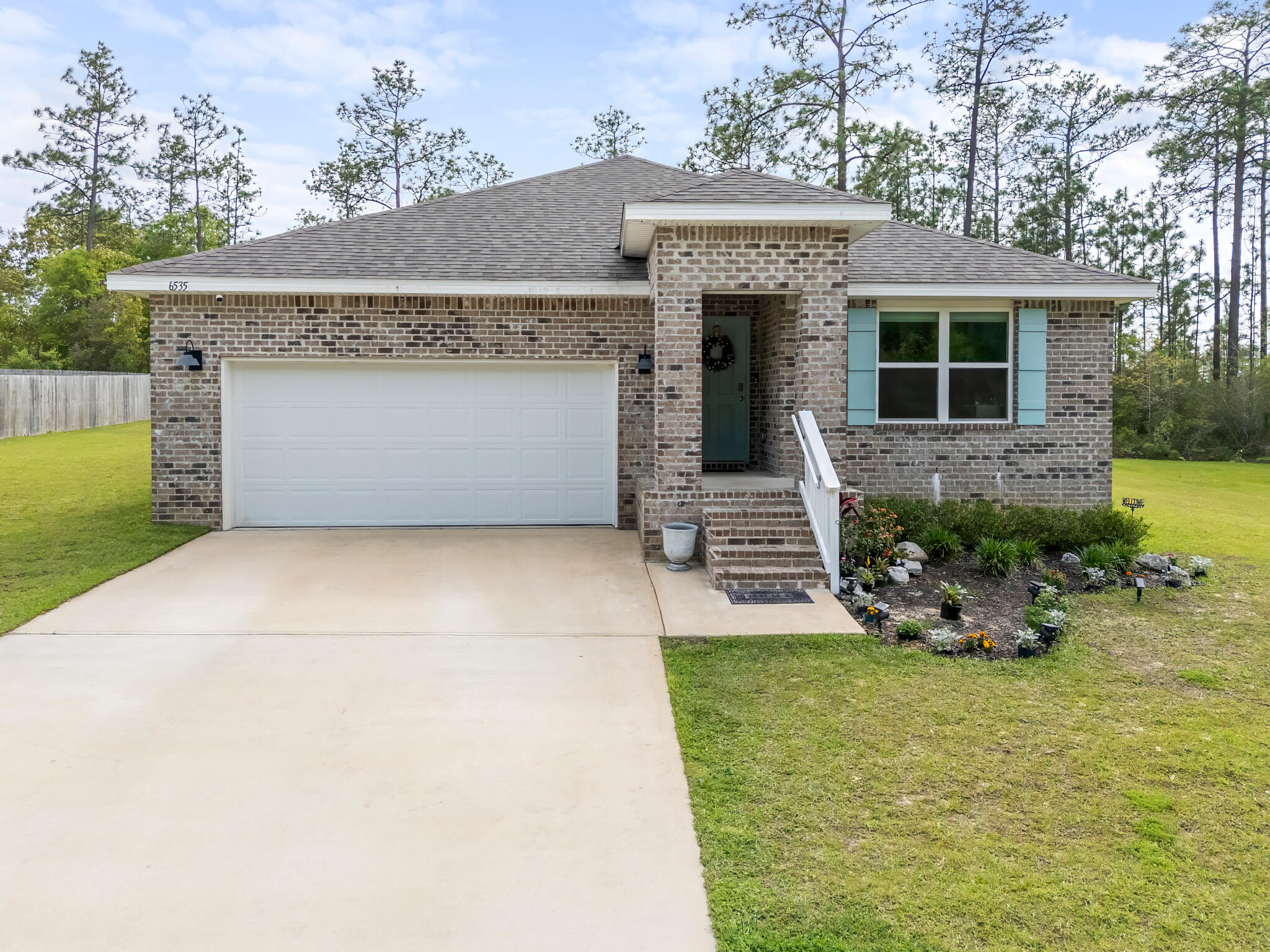 THIS PROPERTY IS A SHORT SALE.

Nestled along the peaceful, tree-lined streets of Heritage Plantation, this all-brick 4-bedroom, 2-bathroom home sits on a premium lot that backs up to a protected wooded preserve, offering a rare level of privacy and natural beauty. With approximately 0.419 acres, the property extends an estimated 12 feet into the preserve, creating a serene backdrop you won't find just anywhere. Elevated along one of the neighborhood's more scenic stretches, the home also captures views of Heritage Plantation's gently winding roads and rolling terrain.

Inside, the home offers a bright, welcoming feel with a functional semi-open layout designed for everyday living. Three well-sized bedrooms, a full guest bath, and the laundry area are positioned toward the front of the home, while the owner's suite is tucked away in its own private wing. The spacious primary suite features two large closets, a double vanity, a walk-in shower, and ample space to comfortably accommodate a king-sized bed.

The kitchen serves as the central gathering point, complete with white cabinetry and a center island that opens to a cozy dining area. Just beyond, a covered patio provides a quiet outdoor retreat overlooking the expansive backyard and lush greenbelt.

Located in Heritage Plantation, residents enjoy a balance of peaceful living and convenient access to nearby shopping, dining, and schools in Crestview, along with neighborhood amenities such as a community pool. Combining a desirable floorplan, a standout lot, and a tranquil setting, this home presents a unique opportunity within one of Laurel Hill's most sought-after communities.