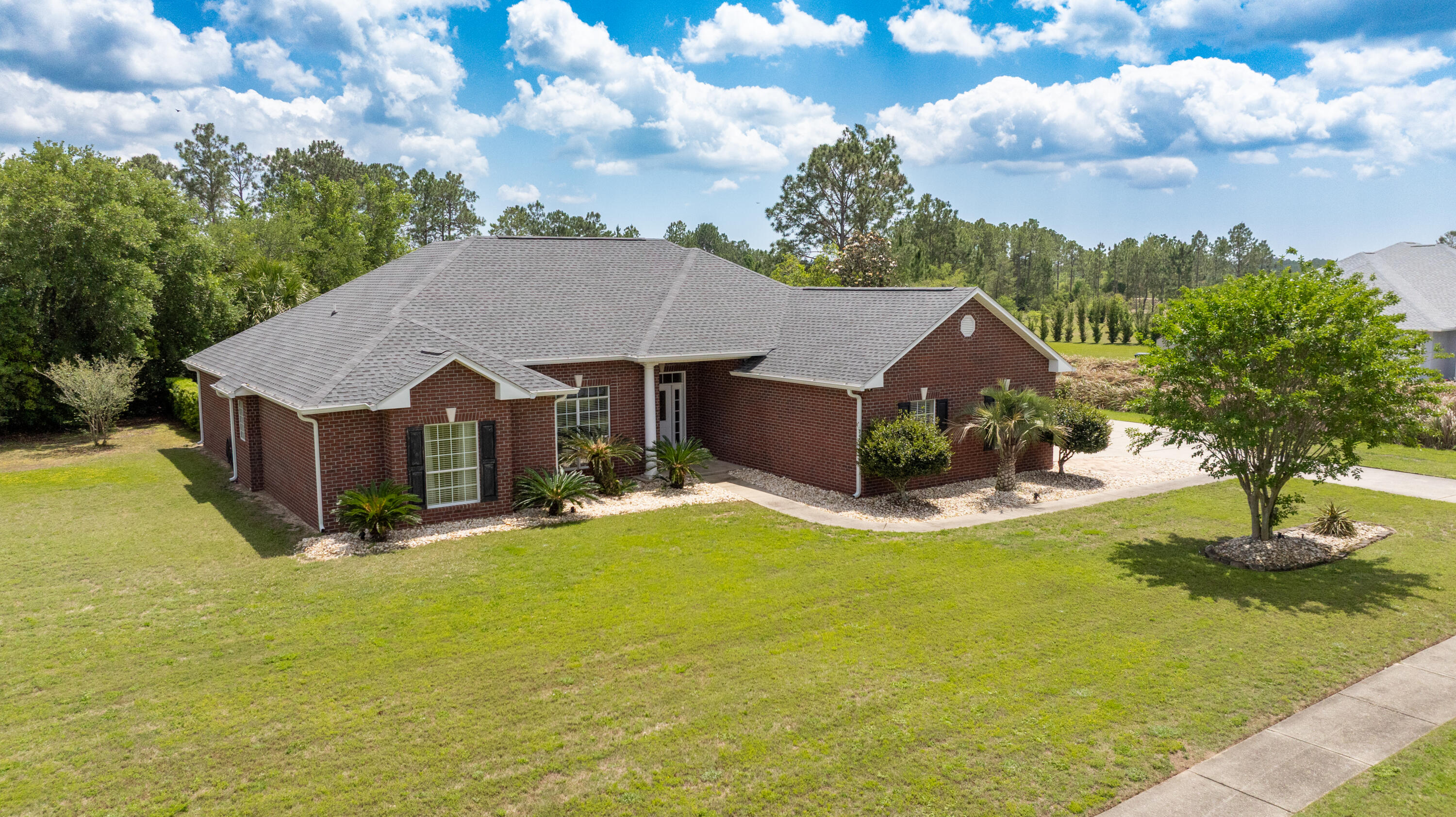 Located in the gated, golf Community in Windswept, Freeport. This well-maintained 3BR/2BA home sits on a serene .73-acre corner lot. The floor plan features tile & laminate flooring, a cozy fireplace, & a spacious primary suite with walk-in closet, garden tub & separate shower. Enjoy outdoor living with a screened lanai covering the in-ground pool, with additional covered & open porches. Special features include a walk-in laundry, mudroom, oversized 2-car garage, enclosed golf cart garage, & extra parking for RV or guests. Brick construction, HVAC & roof were replaced in 2023 making for energy efficiency. equiped with a Generac generator offering peace of mind.  Community amenities include golf, pickle ball, tennis & pool. Approximately 30 minutes to 'Worlds Most Beautiful Beaches. Roof and HVAC were updated in 2023. 

Parking and storage are ample, with an oversized attached two-car garage, a separate enclosed golf cart garage, and additional driveway space with room for recreational vehicles. A covered portico connects the golf cart garage directly to the home through the mudroom, offering added convenience.

The home is constructed with brick siding and a composite shingle roof. Energy features include central electric air conditioning, high-efficiency heating, ceiling fans, and an electric water heater. A Generac whole-home generator provides added reliability during power outages.

Windswept offers a range of amenities including gated entry, golf course access, pickleball and tennis courts, a community pool, playground, and a pet-friendly environment.

Located in Freeport, Florida, the property offers a peaceful residential setting with convenient access to shopping, dining, and daily services. The Gulf Coast's beaches are approximately 30 minutes away, along with the attractions and events throughout Walton County and the scenic Highway 30A area.

This property offers a combination of space, comfort, and community in a well-established neighborhood. Schedule a showing to see all that this home has to offer.
