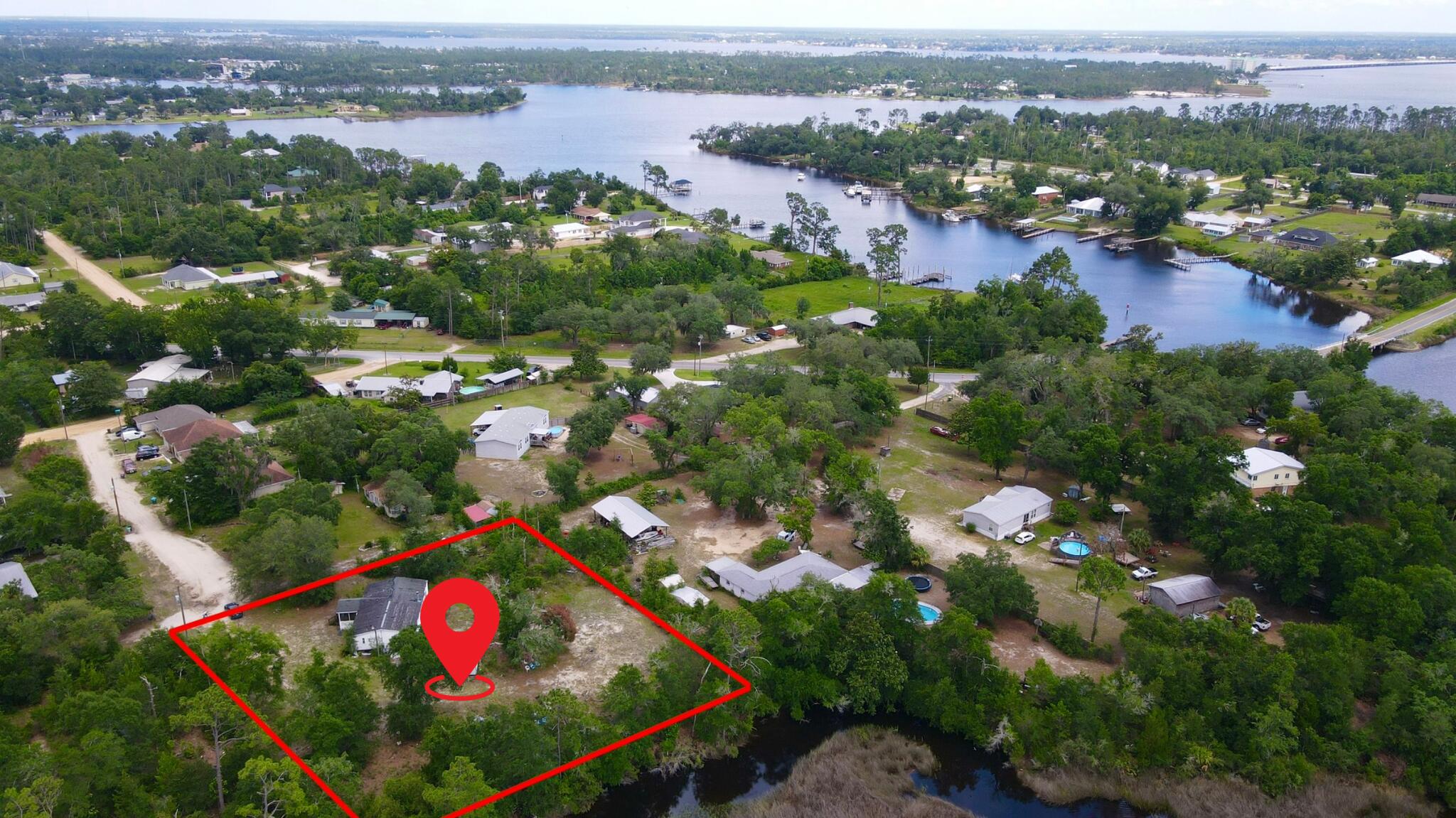 Build your dream home in one of Southport's most scenic waterfront settings. This spacious homesite is tucked along a peaceful tidal creek surrounded by natural marshlands, creating a private and picturesque backdrop filled with native wildlife and beautiful Florida sunsets. The creek winds its way to North Bay, offering a true coastal atmosphere and endless opportunities to enjoy the outdoors.

Whether you enjoy boating, fishing, kayaking, or simply relaxing in a tranquil setting, this property places you in the heart of it all. Surrounded by estate-sized properties and waterfront homes, the area offers the perfect balance of privacy and convenience.

Located just minutes from North Bay access, you'll enjoy easy access to Panama City, Panama City Beach, Northwest Florida Beaches International Airport, shopping, dining, and the sugar-white beaches that make the Emerald Coast famous. Nearby parks, boat ramps, and nature preserves provide even more opportunities to explore and enjoy the Florida lifestyle.

Opportunities like this are becoming increasingly difficult to find. If you've been searching for a homesite with natural beauty, waterfront surroundings, and room to create your own private retreat, 1125 Donald Penny Drive is ready to bring your vision to life.