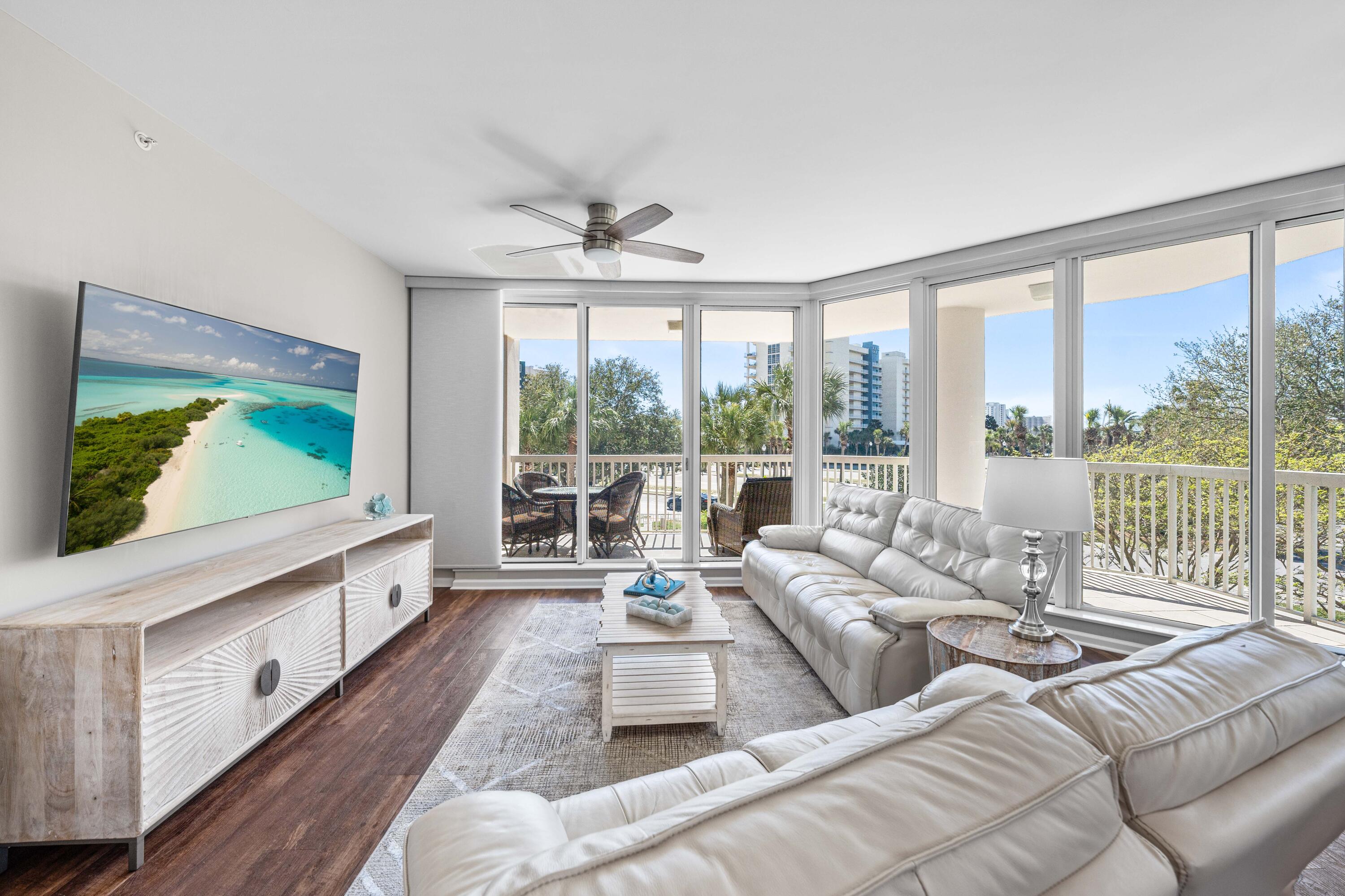 Discover coastal elegance in this gorgeous luxury end-unit condo in the exclusive St. Lucia building at the Silver Shells Resort in Destin where over 1000 feet of private beach with turquoise water and sugar white sand await. Perfect for a permanent residence, beach getaway or short term rental, St. Lucia 306 features calming coastal colors and decor, luxury LVP flooring throughout, quartz countertops, stainless steel appliances, modern lighting, floor-to-ceiling blinds, high ceilings, auto reclining cream color leather sofa and loveseat, and huge windows that allow an abundance of natural light. The open-concept living and dining area extends to two expansive balconies, with Gulf views from the living room balcony. The primary suite includes a king-sized bed, walk-in closet, and it opens to the balcony while the primary en-suite bathroom features dual vanities, a whirlpool tub, walk-in shower, owner's closet and separate linen closet. A split-bedroom layout offers privacy for guests whose bedrooms are on the other side of the foyer; a king bedroom with ensuite bathroom and another bedroom with twin beds and ensuite bathroom both open to the second covered balcony. Additional highlights include a full-size laundry room with utility sink, and electronic filter on the HVAC to filter dust and allergens, four smart TVs (all under three years old), and a 75-inch living room TV- not to mention glimpses of the gorgeous gulf waters from the dining table, the master bedroom and the living area. The unit comes with not only an on-site storage cage for beach gear and other items, but it also includes a dedicated, covered parking space perfect for Florida's warm or occasionally wet weather. Enjoy resort-style amenities, including a massive 7500 square foot lagoon pool, a heated indoor pool, a children's pool and playground, hot tub, fitness center, on-site spa, beachside tiki bar, grill area, tennis courts, pickleball courts, basketball court and Ruth's Chris Steak House. Securely located behind a gated entrance with 24-hour security, and right in the heart of Destin beside Restaurant Row and close to activities like The Track, Big Kahunas Water Park, Destin Commons, the Destin Harbor and Crab Island, St. Lucia 306 is coastal perfection as either a beach retreat or rental investment. With 35k projected in annual rental income and 31k already on the books this year as of mid-April, the possibilities abound. Cruise on over to see how good the coastal life can be at St. Lucia 306.