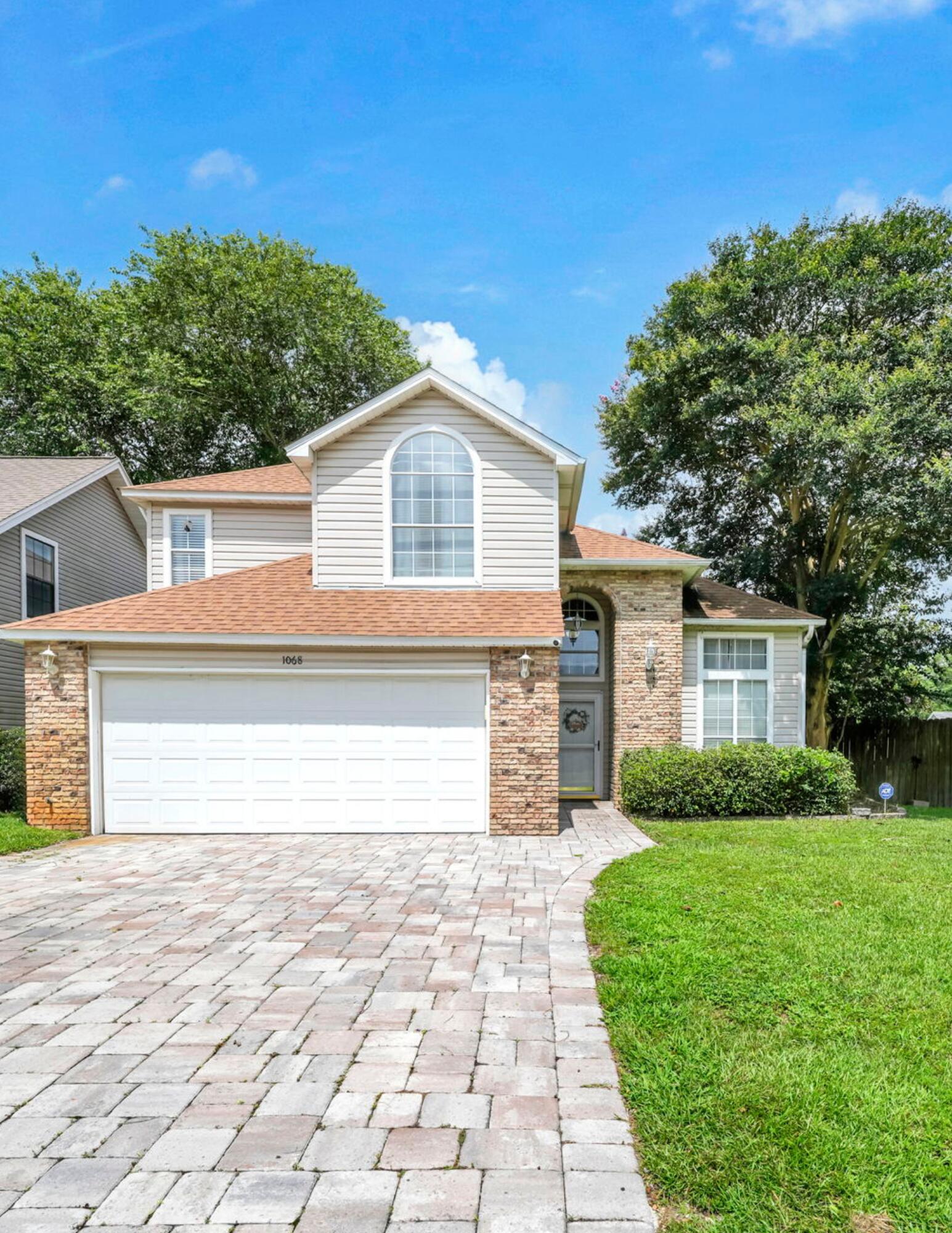 Welcome to this beautiful 4-bedroom, 2.5-bath home situated on a desirable corner lot in Fort Walton Beach. Conveniently located just minutes from Eglin Air Force Base, Hurlburt Field, top-rated schools, shopping, dining, and the stunning Emerald Coast beaches, this home offers the perfect blend of comfort and convenience. Step inside through the impressive two-story foyer with soaring vaulted ceilings that create an inviting first impression. The formal living room is filled with abundant natural light thanks to the vaulted ceilings and large windows, making it one of the most welcoming spaces in the home. The spacious kitchen features an open-concept design, seamlessly connecting to the main living and dining areas. One of the home's standout features is the expansive 22' x 13' Florida Room, offering endless possibilities. No matter what you envision in this space, this versatile room can easily accommodate your lifestyle. Step outside to enjoy the nice backyard featuring a paver patio and an elevated second-story deck and large enough for your boat or RV. The attached two-car garage has been brought to life by the current owners and is outfitted with gym flooring. Upstairs, you'll find the spacious primary suite along with two additional bedrooms. The primary retreat features dual walk-in closets, a large ensuite bathroom with a separate shower, whirlpool tub, + dual vanities. This move-in-ready home is one you don't want to miss!