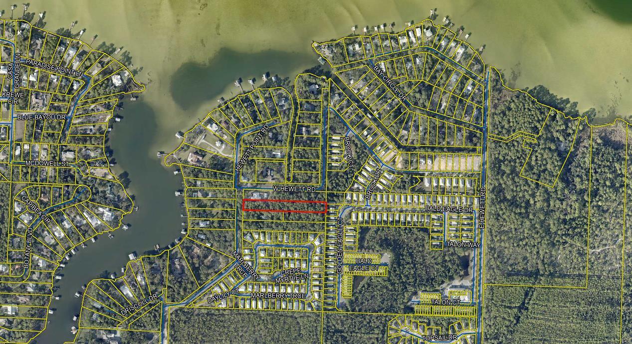 Discover a large exceptional building lot located on West Hewett Road, north of Highway 98, in the highly sought-after area near Choctawhatchee Bay and Sandestin. This spacious lot offers a prime opportunity to create your dream home or investment property in a serene and picturesque setting.

The lot boasts a generous 1.34 wooded acres with ample room for construction, while providing easy access to the beautiful beaches of 30a & Destin and the vibrant community of Sandestin. Enjoy nearby recreational activities, including boating, fishing, and golfing, as well as an array of dining and shopping options.

With its convenient location and potential for bay views, this property is perfect for those looking to embrace the coastal lifestyle.