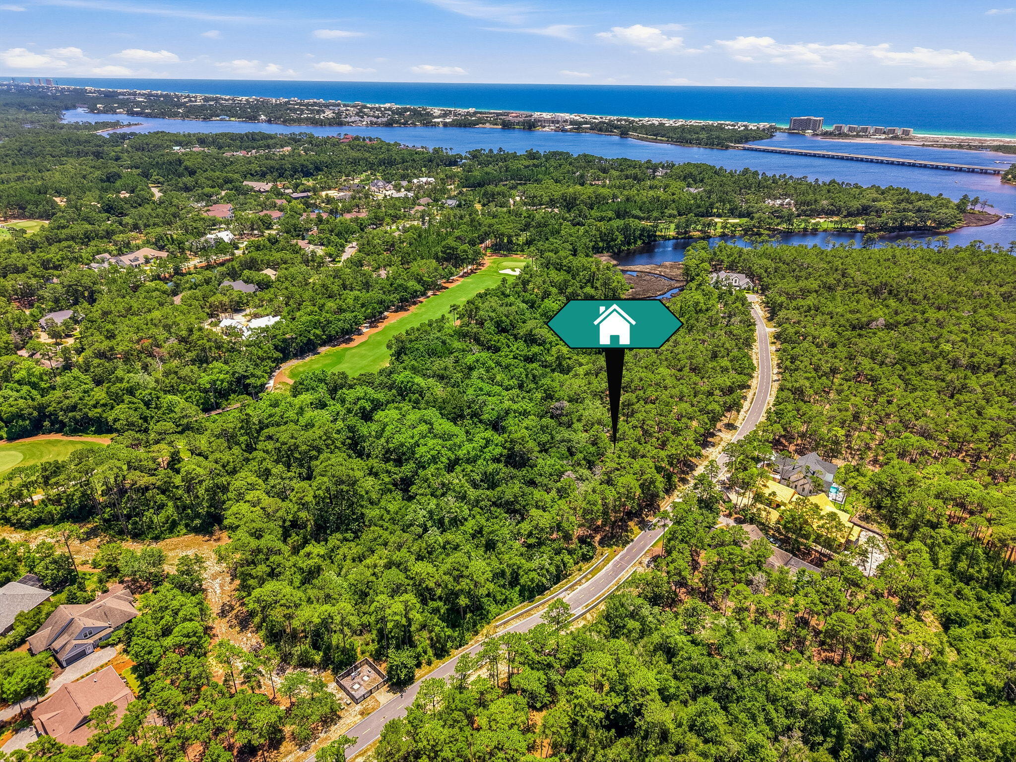 Tucked behind the private gates of Wild Heron, this exceptional homesite spans nearly half an acre and enjoys a serene setting bordered by lush natural vegetation along the renowned Shark's Tooth Golf Course. Encompassing more than 734 acres with frontage on the rare coastal dune Lake Powell, Wild Heron is celebrated as the coastal sanctuary for its seamless blend of luxury amenities, distinctive architecture, and preserved natural beauty. Residents enjoy an unparalleled lifestyle where tranquil surroundings, championship golf, and the area's unique coastal ecosystem come together in perfect harmony. 

Community amenities include a lakefront boathouse and dock, heated pool and hot tub, family park area, walking paths, health club, and lakeside fire pit. Residents also have the opportunity to access the Shark's Tooth Golf Course designed by Greg Norman and hydro-clay tennis facilities through a Clubs by Joe membership. NO short term rentals or long term rentals allowed.