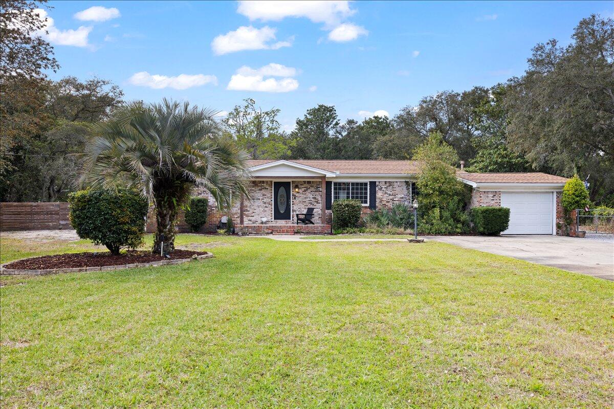 **Under contract with a kick out clause** Beautifully remodeled pool home situated on a large, fenced half-acre lot with NO HOA in highly sought-after West Destin! This spacious property perfectly combines modern style, comfort, and functionality with an open-concept floor plan designed for both entertaining and everyday living. Lots of recent updates such as a new waterheater installed May 2026!  The stunning contemporary kitchen has been beautifully updated and features hardwood KraftMaid cabinetry, gorgeous Dekton countertops, Frigidaire appliances, and an oversized breakfast bar perfect for gathering with family and friends. Abundant natural light fills the home, creating a bright and inviting atmosphere throughout.
The private primary suite offers a custom barn door entry and elegant French doors leading directly to the pool deck, creating the perfect private retreat. The luxurious primary bathroom was fully renovated in 2024, and the home also received new exterior siding the same year. Three additional bedrooms provide ample space for family and guests, including one bedroom with direct pool access and its own private half bath. Step outside to your own backyard oasis featuring an expansive paved pool deck, separate hot tub, and a massive fenced backyard complete with a workshop -- ideal for storing boats, RVs, golf carts, and all your outdoor toys. Bring your boat and RV -- there is plenty of parking and storage space with no HOA restrictions. Perfectly located for boating and outdoor enthusiasts, 809 Jupiter Street is within 10 minutes or less of several of Destin's premier waterfront parks and boat launches. Joe's Bayou Boat Launch offers quick access to Crab Island and Choctawhatchee Bay, while Destin Marina Harbor Launch provides immediate access to the Destin Harbor. Nearby parks including Captain Leonard Destin Park and Liza Jackson Park offer paddlecraft launches, playgrounds, waterfront access, and family-friendly amenities.
Conveniently located near Destin's world-class beaches, less than one mile from Destin Elementary, approximately two miles from Target, and just minutes from shopping, dining, boating, and entertainment, this exceptional property offers the perfect combination of privacy, space, and coastal living.