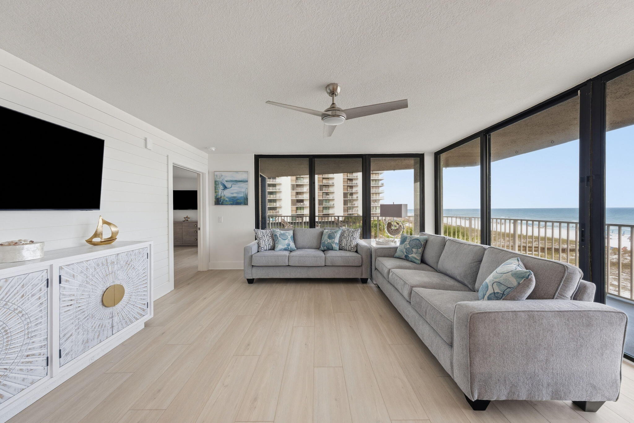 Completely renovated Gulf-front corner unit with panoramic beach views, a wraparound balcony, designer finishes, and direct access to over 700 feet of private sugar-white beachfront at Mainsail. Welcome to Mainsail 221, a stunning beachfront residence where modern coastal elegance meets the breathtaking beauty of the Emerald Coast. Extensively renovated from top to bottom, this exceptional condominium offers spectacular Gulf views from the living area, kitchen, primary suite, and expansive wraparound balcony.

Designed to maximize both comfort and scenery, the open-concept floor plan is filled with natural light from walls of glass overlooking the beach. The beautifully redesigned kitchen features custom cabinetry, quartz countertops, abundant workspace, updated appliances, and a picture window framing the Gulf waters beyond. Luxury plank flooring, updated lighting, and sophisticated coastal finishes create a bright, welcoming atmosphere throughout. The spacious living and dining areas flow seamlessly onto the oversized balcony, providing the perfect setting for entertaining, relaxing, or simply enjoying the sound of the waves and breathtaking Gulf views.

The primary suite serves as a private waterfront retreat with balcony access, floor-to-ceiling glass, and a beautifully updated spa-inspired bath featuring designer tile work and custom finishes. Offered beautifully furnished and move-in ready, this residence is ideal as a primary home, second home, or vacation rental Mainsail is one of Miramar Beach's most sought-after gated Gulf-front communities featuring over 700 feet of private beach frontage, two pools, hot tub, fitness center, , covered parking for owners , and beautifully maintained grounds.

Conveniently located near Silver Sands Premium Outlets, championship golf courses, dining, entertainment, and all that Miramar Beach and Scenic Highway 30A have to offer, owners enjoy the perfect blend of beachfront tranquility and modern convenience. The corner-unit location provides additional windows, enhanced privacy, and some of the most desirable views within the community.

Whether you're looking for a luxurious personal retreat, a family beach getaway, or a turnkey investment property, Mainsail 221 offers a rare opportunity to own a beautifully renovated Gulf-front residence in one of the Emerald Coast's premier beachfront communities. Wake up to the sound of the waves, spend your days on the sugar-white sand, and end each evening watching unforgettable sunsets from your private wraparound balcony. This is the coastal lifestyle you've been dreaming about.