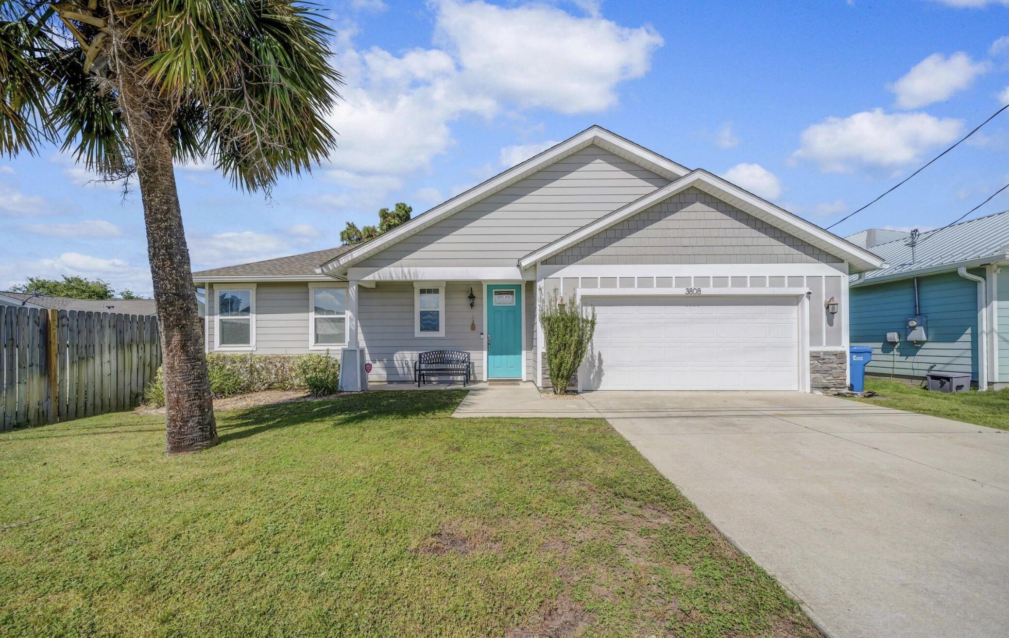 Turn Key and Renal Ready for the 2026 Rental Season! Walk to the beach from this coastal , newer construction 3-bedroom, 2.5-bath home with garage! This beautiful home has a great location and perfect for full-time living, a beach getaway, or a vacation rental! Thoughtfully designed with open concept and tile floors, quartz countertops, charming shiplap accent wall, and a covered porch overlooking the fenced backyard complete with a hot tub! NO HOA and short-term rentals are allowed! Just a short stroll to beach access at the end of the street and only 1/4 mile to the Grand Lagoon boat ramp. Conveniently located near St. Andrews State Park and just a quick drive to Pier Park. Don't miss your chance to make this your next home away from home!