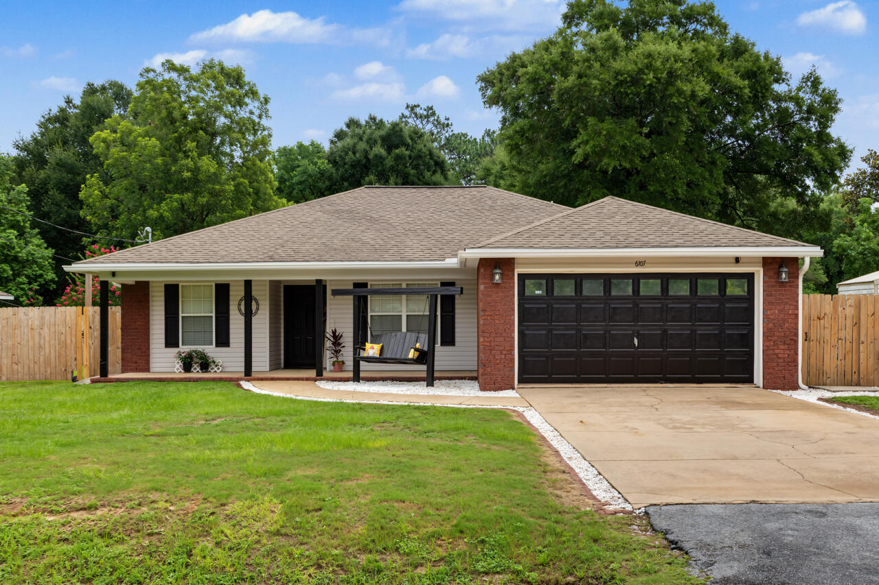 Welcome home to this spacious 4-bedroom, 2-bath home situated on a flat lot with no HOA! Relax on the inviting covered front porch or enjoy outdoor living year-round under the large covered back patio overlooking the fully fenced backyard. Need extra storage or workspace? The attached worksheet is equipped with power, and the double gate provides easy access for parking a boat, trailer, or other equipment. Inside, you'll find an open, functional layout with recessed lighting, and a spacious living area perfect for everyday living or entertaining. The kitchen features abundant cabinetry, a stylish tile backsplash, and overlooks the main living space. The primary suite offers tray ceilings, a walk-in closet with additional custom shelving, dual vanities, a soaking tub, and a separate shower. Additional closets throughout the home have been enhanced with extra shelving for added organization. Roof to be replaced with an acceptable offer, providing added peace of mind for the new owner. Conveniently located near schools, shopping, dining, and military bases, this home offers comfort, functionality, and room to enjoy both inside and out.