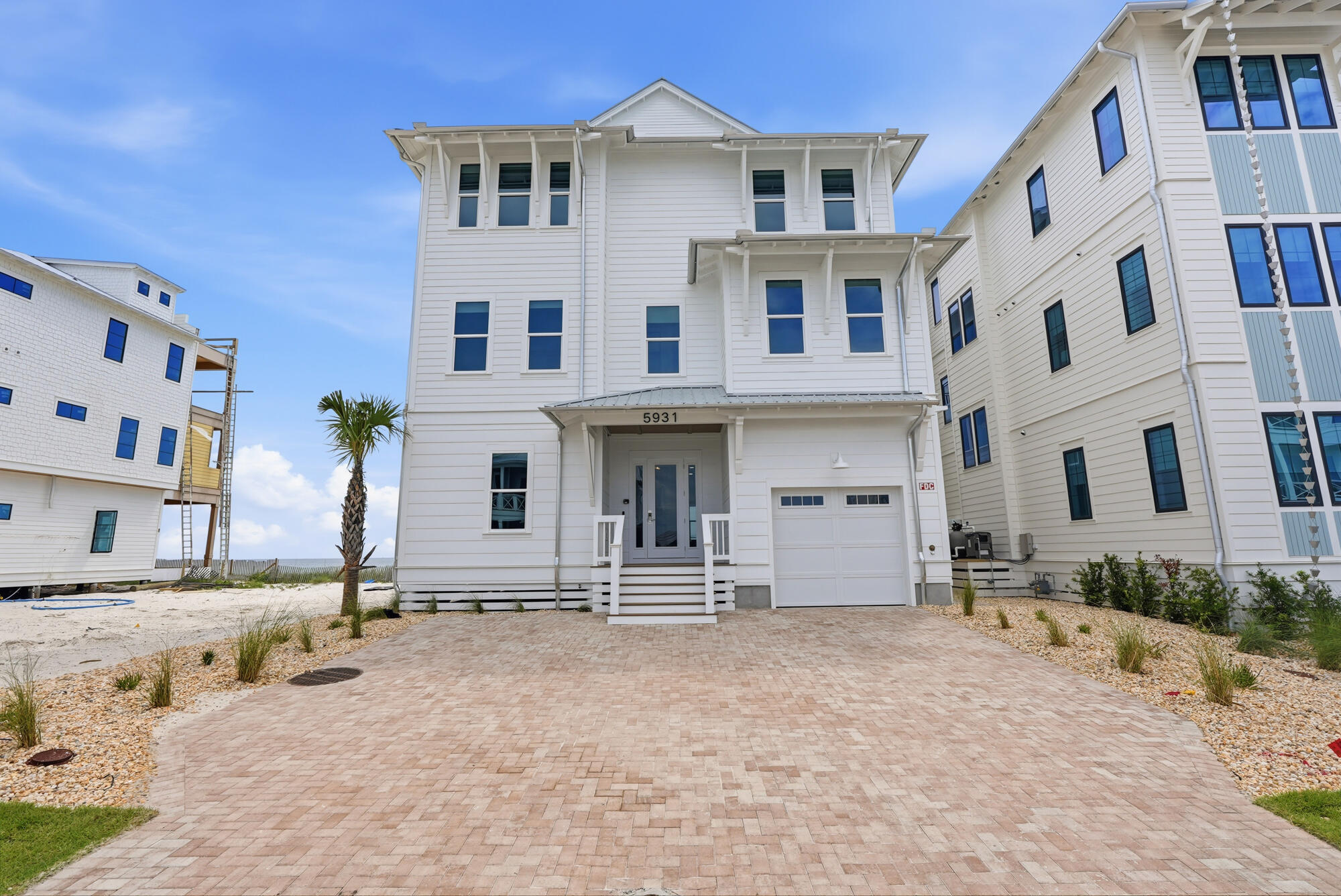 There is something timeless about waking to the sight of the Gulf stretching endlessly beyond your window. At 5931 Gulf Drive, that experience becomes part of everyday life. Positioned directly on the shoreline within Hadley's Beach, an intimate community where only ten residences enjoy true Gulf-front placement, this fully furnished home invites you to live at the water's edge, where the rhythm of the waves sets the pace of the day.

Spanning 5,031 square feet, the residence was designed around the view. From the moment you enter, the Gulf commands attention--an ever-changing backdrop of turquoise water, white sand, and expansive coastal sky. Sunlight moves effortlessly through the home's generous living spaces, creating an atmosphere that feels both elevated and welcoming.

The heart of the home is where people naturally gather. A beautifully appointed kitchen with premium appliances opens seamlessly into the living and dining areas, creating a setting equally suited for celebratory dinners, holiday gatherings, or quiet mornings with coffee overlooking the shoreline. Every space feels connected, designed to bring family and friends together while never losing sight of the water beyond. With seven bedrooms and eight-and-a-half bathrooms, the home offers room to spread out and settle in. Yet it is the third-floor primary suite that truly captures the imagination. Elevated above the coastline, it feels almost suspended between sea and sky. Here, sweeping Gulf views greet the morning, while evenings are framed by breathtaking sunsets reflected across the water.

Outside, life naturally gravitates toward the Gulf. A private pool offers a refreshing retreat between beach walks, while the shoreline itself is just steps away. Days begin with sunrise strolls along the sugar-white sand and end with conversations carried by the sound of the surf. Thoughtful additions such as two laundry rooms and an elevator servicing all levels bring comfort and convenience to everyday living.

Offered fully furnished and with short-term rentals permitted, the home is prepared to be enjoyed from the moment you arrive. Whether envisioned as a gathering place for generations, a coastal retreat, or an investment in one of Panama City Beach's most desirable beachfront communities, the experience remains the same: effortless, refined, and deeply connected to the beauty of the Gulf.

At 5931 Gulf Drive, the shoreline is not simply a view--it becomes part of the way you live.
