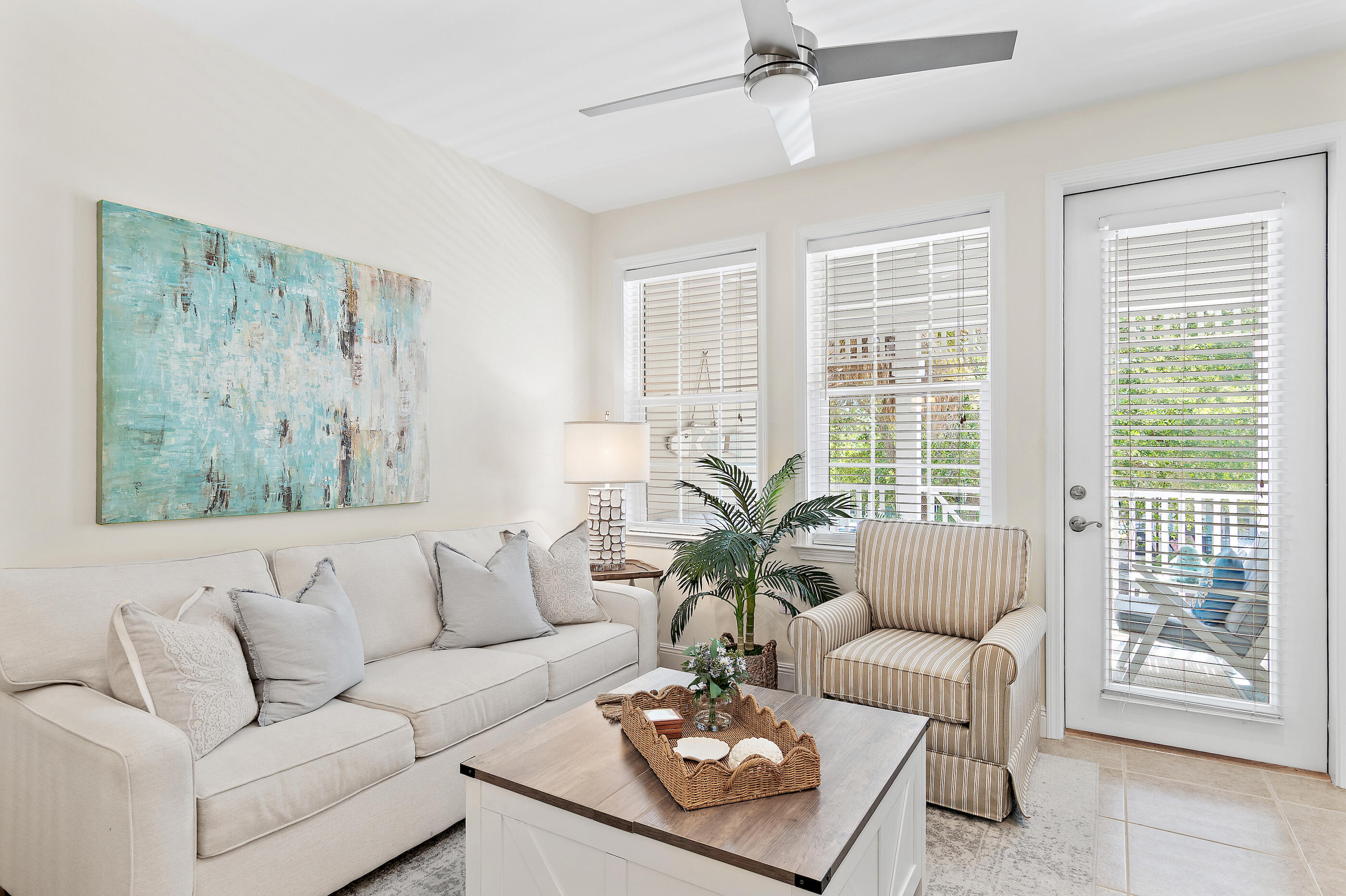 Perched at the pinnacle of the gated Village at Blue Mountain Beach, this top-floor corner residence offers a sophisticated retreat where coastal elegance meets modern luxury. Recently reimagined with a meticulous eye for detail, the interior showcases a seamless blend of organic textures and high-end finishes. From the fresh, airy palette to the intentional design choices, every inch of this three-bedroom sanctuary feels curated and elevated.

The open-concept living space is grounded by stunning tile flooring and complemented by designer furnishings that convey a sense of effortless style. The primary bedroom serves as a true private haven, featuring a dedicated ensuite bathroom for ultimate comfort. Step outside to the large private balcony--the perfect vantage point to take in views of the sparkling community pool below while enjoying the coastal breeze.

Life at The Village is defined by resort-caliber amenities. Spend your afternoons lounging by the expansive pool, perfecting your short game on the putting green, or maintaining your wellness routine in the fitness center. With dedicated golf cart parking and two secure gated entrances, convenience is paramount.

The emerald waters and sugar-white sands are less than half a mile away, while an array of celebrated fine dining and boutique shopping is easily accessible. Whether envisioned as a refined residence or a prestigious addition to a property portfolio, this top-floor condo offers an unparalleled lifestyle.
