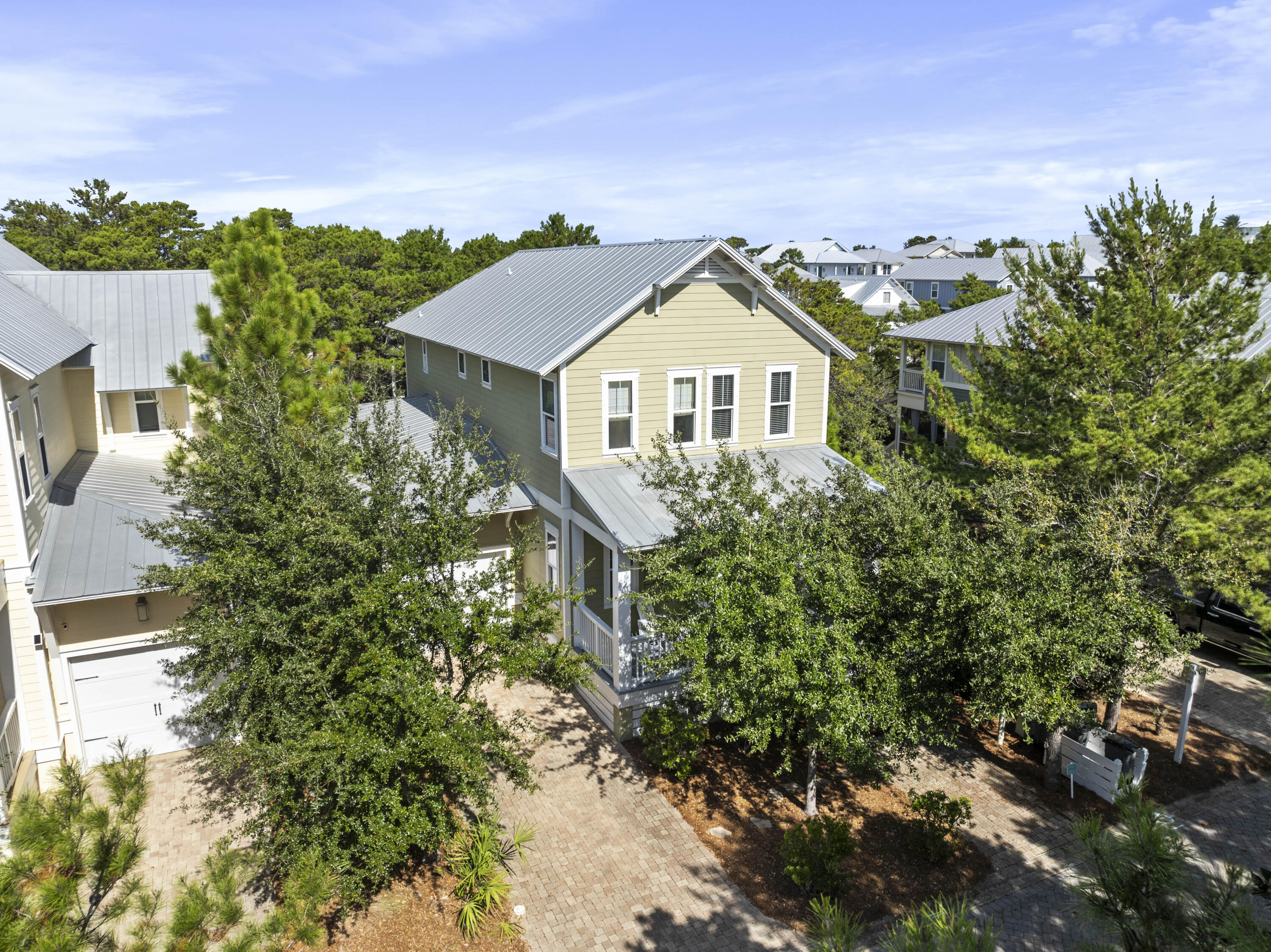 Nestled in the highly sought-after Highland Parks community in Blue Mountain Beach along Scenic 30A, this stunning 4-bedroom, 4.5-bath home offers the perfect blend of comfort, style, and coastal charm. Designed with an abundance of natural light, the home features large windows that fill the open-concept living space with warmth and brightness. Ideal for both full-time living and investment, the thoughtfully designed floor plan includes two spacious primary suites--one conveniently located on the first floor and another on the second--providing flexibility and privacy. The main living area flows seamlessly to a generous rear porch, perfect for relaxing or entertaining guests.

Upstairs, you'll find two additional bedrooms, a versatile bunk room ideal for guests or rental flexibility, and the second primary suite, offering ample space for family and visitors. Enjoy peaceful views of the green space directly behind the home, complete with a walking path that leads to the neighborhood's resort-style pool and amenities.

Whether you're seeking a primary residence, second home, or rental opportunity, this property captures the essence of 30A living with its prime location, functional layout, and inviting indoor-outdoor lifestyle.