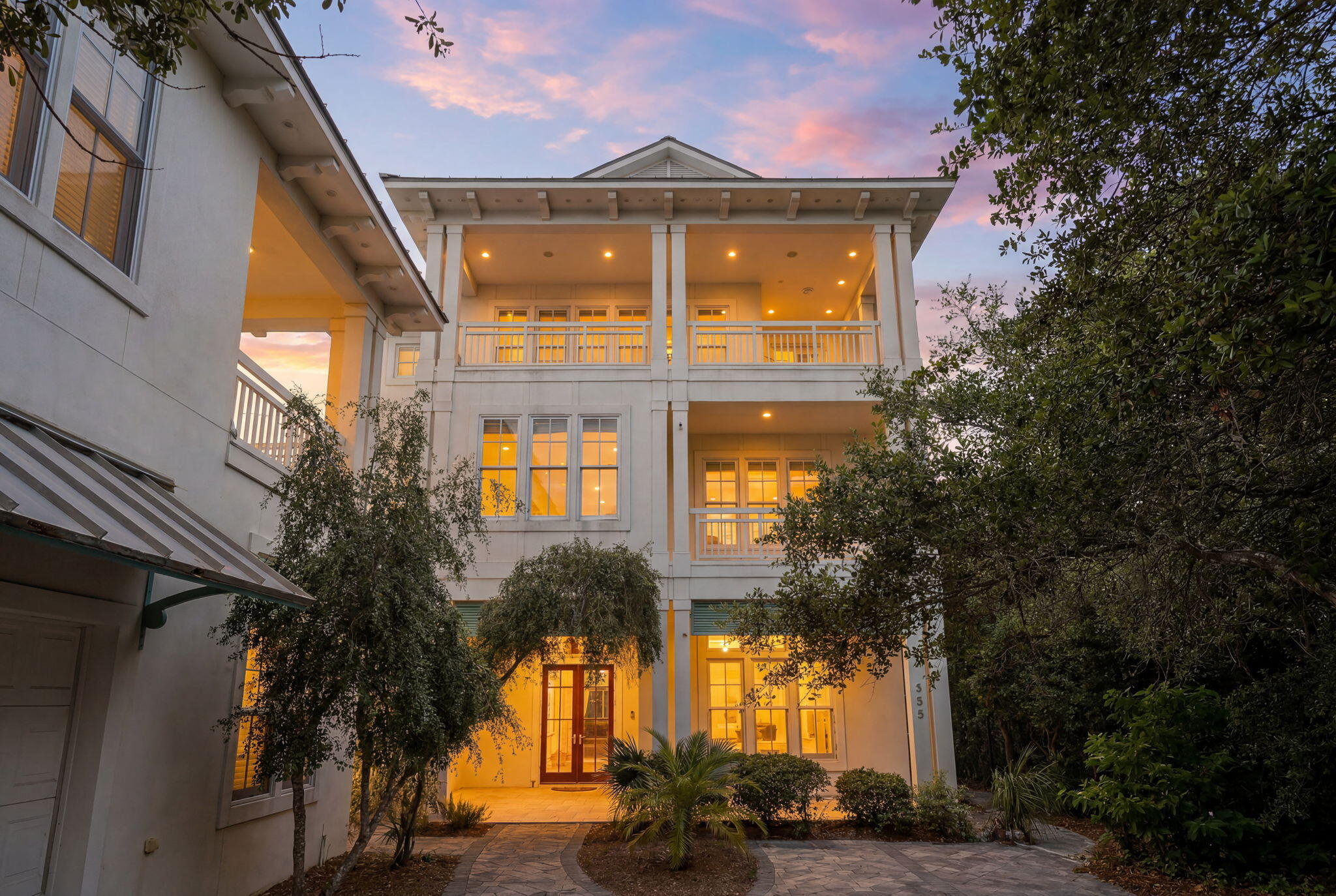 Designed with entertaining in mind, this lakefront residence in Blue Mountain Beach sits on Big Redfish Lake, one of the world's rare coastal dune lakes, offering peaceful lakefront living with the Gulf just across the street. Spanning approximately 5,276 square feet, the home features thoughtful design, high-end systems, and refined finishes throughout. The first floor offers 12-foot ceilings, recessed lighting, and a well-equipped kitchen ideal for hosting, complete with Sub-Zero appliances and a raised ventilation system over the stove. A custom pantry includes a dedicated juicing area with its own sink. A nearby half bath and elevator access to all levels add convenience.

The second floor is anchored by a private primary suite featuring Brazilian walnut flooring, a spa-like bathroom, a large walk-in closet with custom shelving, built-in sound wiring, and a kitchenette. A secondary guest bedroom, built-in bookcases, and an additional kitchenette with a microwave, sink, and beverage chillers provide flexible living options. A large patio with lake views connects directly to the carriage house, creating seamless indoor-outdoor flow.

The third floor is designed for entertaining, offering Brazilian walnut flooring, a gas fireplace, automatic window shades, ceiling speakers, a projector, theatre seating, two Sub-Zero wine coolers, a half bath, and a spacious lakefront patio. The elevator was serviced and inspected in 2025.

The gated outdoor space includes a pool with screened enclosure, irrigation system, direct lake access, and a private dock with power and water. The home is supported by three HVAC systems, including two geothermal units, one newly installed in 2025, along with a conventional system added in 2023.

The 812-square-foot carriage house offers a private bedroom with two closets, a full bath with walk-in shower, and a dedicated laundry room, ideal for guests or extended stays.

Located with easy access to the Timpoochee Trail for biking and walking, this home offers proximity to everything Scenic 30A has to offer. Sugar-white sands, emerald Gulf waters, fine dining, beloved local dives, and favorites like Blue Mountain Beach Creamery are all just moments away, delivering a rare combination of coastal dune lake living, Gulf convenience, and elevated design in the heart of Blue Mountain Beach. Contact us for more information or a private showing.



All information is deemed reliable and provided for informational purposes; buyers are encouraged to independently verify all details.