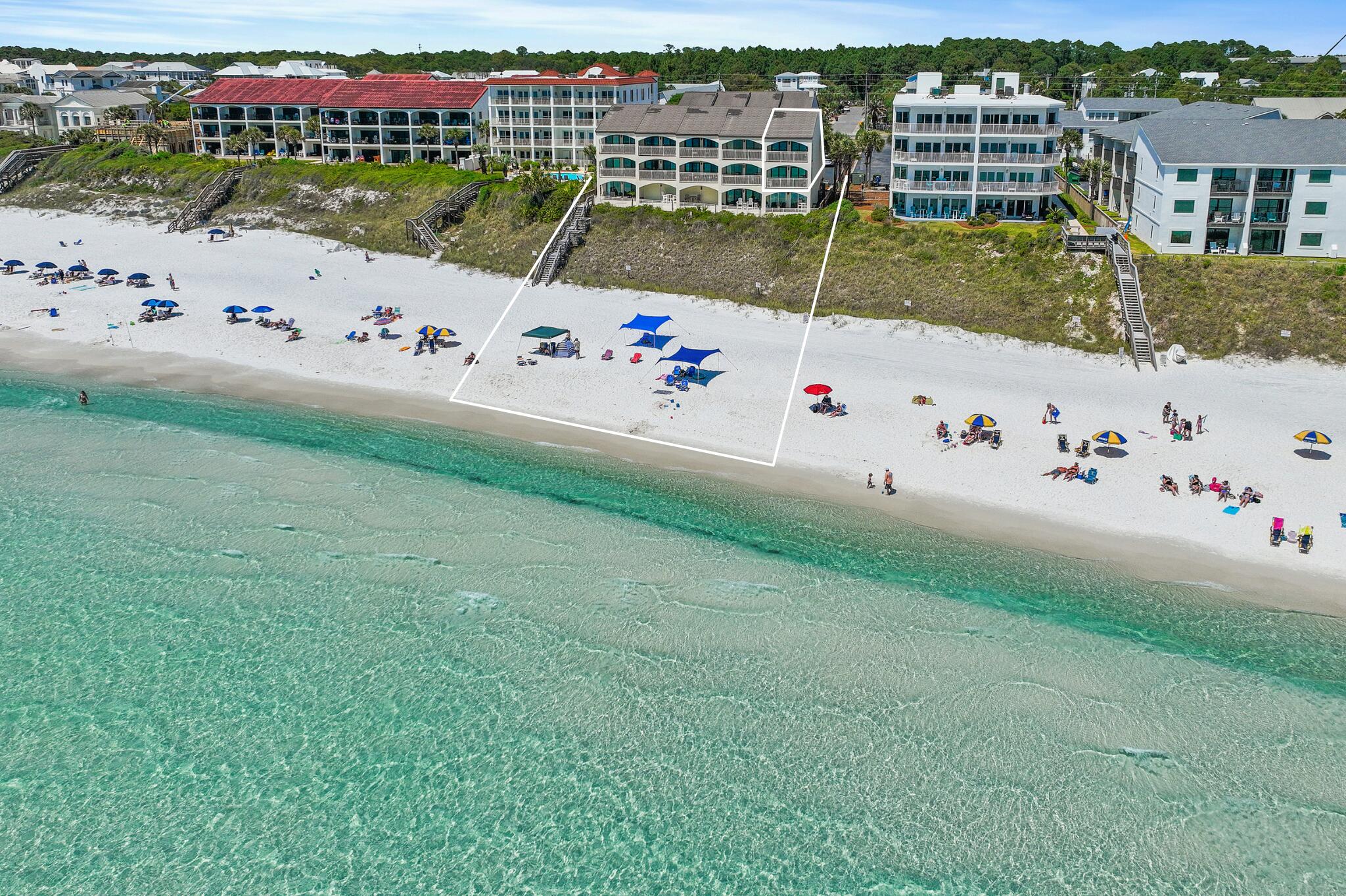 Prominently positioned to showcase the stunning views of turquoise-hued waters on 30A throughout the unit, this like-new and never rented, coastal retreat spans three distinct levels totaling over 1,800 square feet. Upon initial entry, you're welcomed by a hallway that opens into a spacious main living and dining area, featuring stunning Gulf views, a thoughtfully designed coastal color palette, and soaring ceilings accented by elegant wood-plank tile flooring. Step outside to the adjoining arched terrace, the perfect place for admiring the beautiful palate of mesmerizing hues with unobstructed 180-degree views. The fully renovated kitchen features a luxury appliance suite, stunning quartz countertops coupled with a stunning backsplash and new fixtures. The primary suite, tucked away on the second level, is a true sanctuary of relaxation. Floor-to-ceiling windows flood the space with natural light and frame sweeping, unobstructed views of the beach and Gulf. Step out onto your private Gulf-front balcony to feel the ocean breeze and listen to the soothing rhythm of waves crashing along the shore. The spa-like ensuite features dual vanities, a walk-in wet room and custom cabinetry providing additional storage options. Just down the hall, the guest suite offers 2 queen size beds, a private bath and terrace overlooking the community's pool. The top floor loft quarters boast two twin size beds and is perfect place for the teenagers and kids to hang out.

This, fully furnished end-unit has been immaculately maintained and features tons of premium upgrades to include all new high impact windows and sliders, furnishings, fixtures, a new washing machine and dryer, new AC (2021) with integrated UV air filtration, professionally cleaned ductwork, a new water heater (2018), and is equipped with automatic hurricane shutters that were recently serviced, and much more.

The low-density community of Seagrove Dune Villas is tucked away in the heart of Seagrove Beach sprawling on nearly two acres and located further away from the public beach accesses, providing a more intimate and private setting..The complex is well maintained and just completed some recent updates which include adding dedicated golf-cart parking, landscaping rejuvenation, newly painted exterior, a newly resurfaced pool to include new pool loungers, a newly rebuilt boardwalk and paver path to the beach, and much more!
The culmination of luxury and exclusiveness creates a truly intimate setting while remaining geographically poised near all of the acclaimed dining and entertainment venues 30A has to offer and is just one mile east of Seaside! Impressive rental potential with projections over $115,000 per year and basically all-inclusive dues makes this a compelling opportunity for both investors and second-home residents alike. Inquire today and start living the coastal lifestyle.
