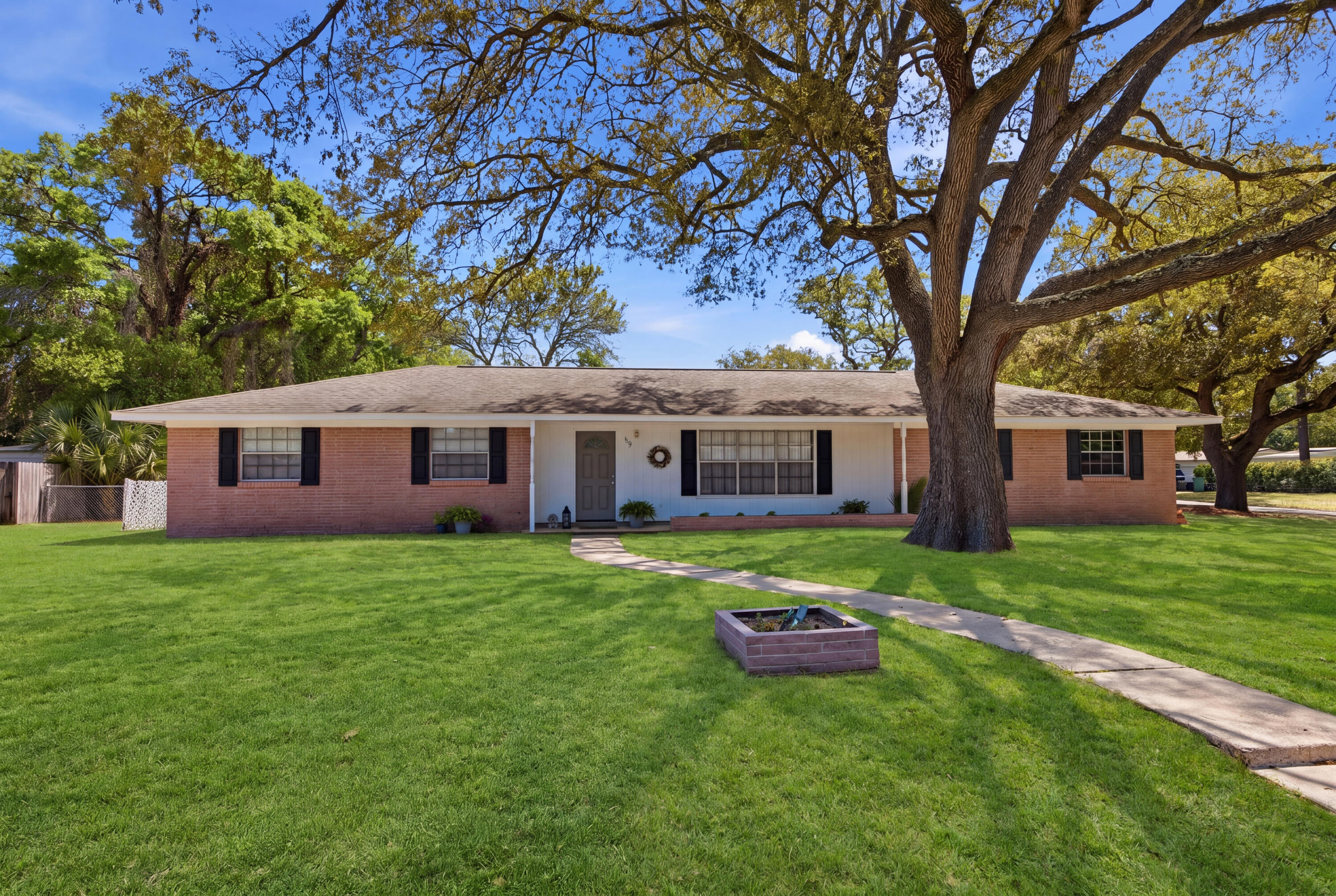 Perfect for buyers seeking both convenience and peace of mind, this well-maintained home at 119 Jamestown Ave offers a prime central location in Fort Walton Beach, just minutes from Hurlburt Field, Eglin AFB, beautiful Gulf Coast beaches, and highly rated zoned schools. Inside, you'll find a home that has been thoughtfully cared for with numerous system upgrades already completed for you. The HVAC system (2019) and has been consistently maintained, including recent updates to key components in 2022, 2024, and 2025, along with professional duct cleaning. Major plumbing improvements include a new hot water heater (2023), updated fixtures throughout, resurfaced bathtub, and a full replacement of the main water line with durable PEX piping, plus a newly installed water pressure regulator. Electrical updates include a replaced panel (2019) and routine system checks, offering added confidence in the home's infrastructure. Additional interior touches such as updated toilets, a modern kitchen faucet, and a new bedroom ceiling fan enhance everyday comfort, while exterior upgrades including a new front door, automatic garage door opener, full window screen replacement, and an irrigation system with lawn pump, add both function and curb appeal. The 2-car garage offers a workshop-style setup with built-in benches and shelving ready for your next project.  Mature live oak trees have also been professionally pruned, enhancing the beauty of the property. Whether you're commuting to base, heading to the beach, or enjoying the nearby schools and amenities, this home delivers an ideal blend of location, upgrades, and livability.