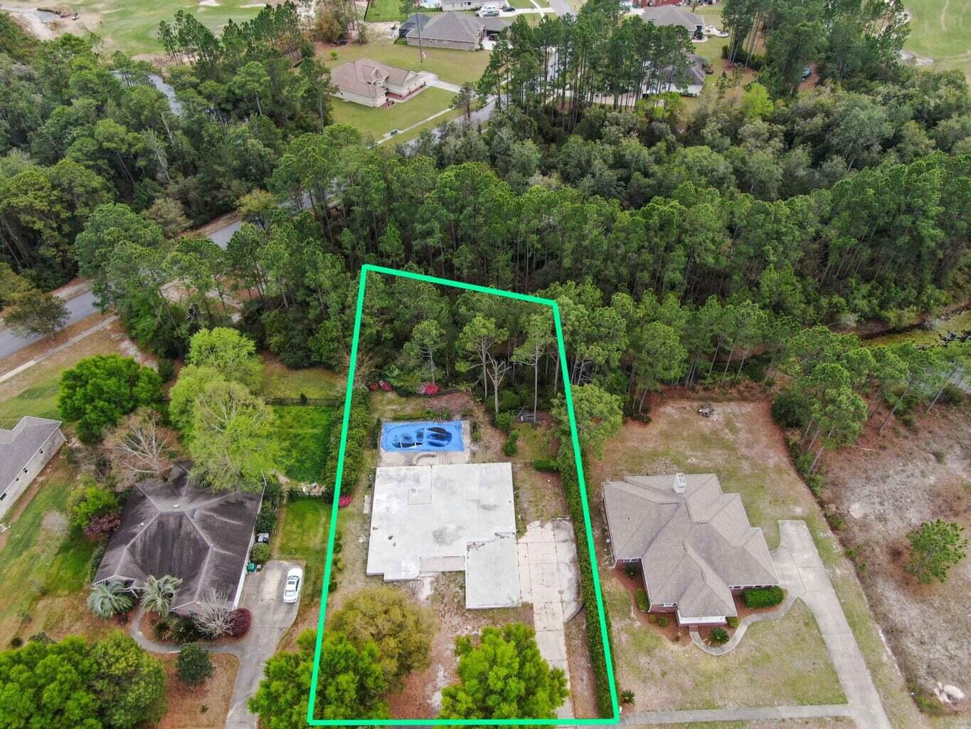 Build your dream home without the typical delays on this premium .49-acre lot in the prestigious, gated community of Windswept Estates. Surrounded by the 5-star Windswept Dunes Golf Course, this property is a turnkey opportunity for those ready to build.

The Ultimate Head Start
Skip the months of site prep and permitting. This lot is ''shovel-ready'' with infrastructure already in place:

Foundation: CMU slab foundation is poured and ready for framing.

Plans Included: Comes with a full set of engineered plans for a 2,606 sq. ft. main floor, plus a 400-600 sq. ft. upstairs bonus room.

Existing Utilities: Septic system and shallow irrigation well are already installed.

Propane Ready: On-site in-ground propane tank.

The Outdoor Oasis features:

An existing in-ground gunite swimming pool framed by elegant brick pavers.

A disassembled screen enclosure (included) ready for re-installation.

Professional landscaping and partial fencing for immediate curb appeal.

A wooded backyard buffer for added privacy.

Premium Location & Lifestyle
Enjoy the quiet luxury of golf-course living while staying just 20 minutes from the world-famous white sugar sands of Destin and Santa Rosa Beach.

Windswept Estates Amenities:
Clubhouse and community swimming pool.
Tennis and basketball courts.
Playground and nature-rich walking trails.
Fishing pond with dock.
A vibrant community atmosphere featuring week weekly food trucks.

This is a rare chance to bypass the ''waiting game'' of new construction.