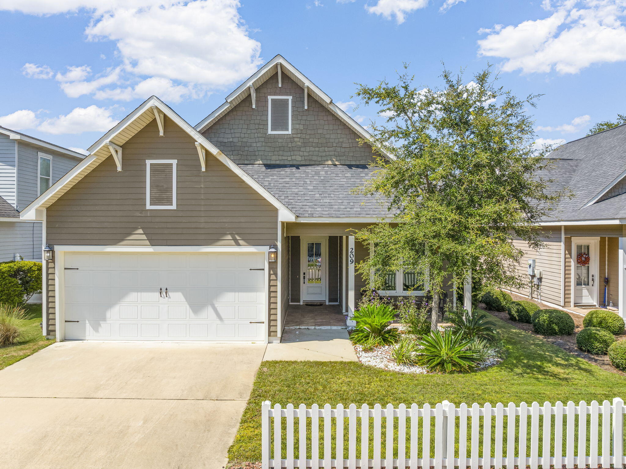 Discover Paradise Cove--a charming community where every home is framed with a classic white picket fence and neighbors enjoy a relaxed coastal lifestyle just minutes from the beaches of Seaside, Seagrove, and Grayton. Built by Boswell Builders, one of the area's most trusted luxury home builders with over 45 years of experience, Paradise Cove offers timeless craftsmanship in a setting designed for full-time living. (No short-term rentals allowed.) This single-story, 3-bedroom, 2.5-bath home features an open and airy layout with 10' ceilings, crown molding, and rich hardwood flooring throughout the main living areas. The gourmet kitchen is designed to impress with granite countertops, stainless steel appliances, and custom cabinetry with soft-close features. The spacious primary suite includes dual vanities, a whirlpool tub, a separate walk-in shower, and an oversized walk-in closet.

Additional highlights include an oversized two-car garage, single-level living, and access to resort-style community amenities such as a neighborhood pool with cabana and bathrooms.

Ideally located, Paradise Cove is convenient to top-rated schools, shopping, dining, Eden Gardens State Park, the public boat launch to Choctawhatchee Bay and the Intracoastal Waterway, and all the best of 30A.

Experience the perfect blend of luxury, location, and lifestyleyour coastal retreat awaits at 209 Blakely Drew Blvd.