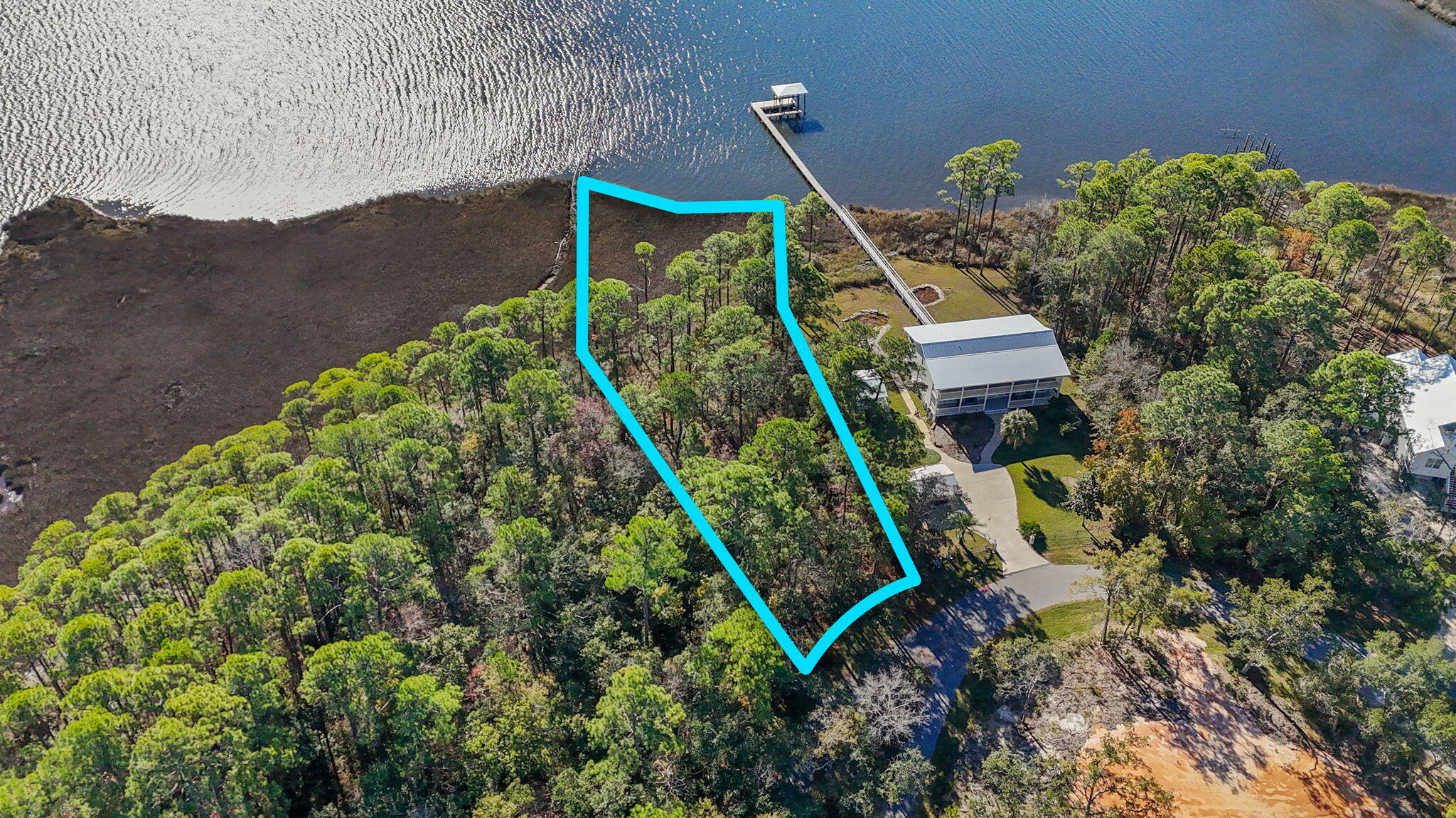 Waterfront land for sale on LaGrange Bayou in Freeport, Florida! Escape big city life and build your dream coastal retreat on this approximately .87-acre bayfront homesite, one of only a few lots in the neighborhood with ownership extending into the conservation area, offering the potential ability to obtain permits for a private boat dock. With access to Choctawhatchee Bay, this Florida waterfront property is ideal for buyers searching for a boating lifestyle near Destin and 30A. Cruise to Crab Island and Destin Harbor in approximately 20 minutes depending on boat speed and conditions, fish from your backyard, or enjoy paddleboarding and coastal living along the Emerald Coast. This wooded lot will need to be cleared. No HOA fees, only community CC&Rs designed to preserve the neighborhood character with site-built homes only, a maximum two-story height restriction, and no RVs or mobile homes permitted. Perfect for a custom home, second home, waterfront retreat, or investment opportunity in Freeport FL. Come live the quiet waterfront lifestyle only minutes from 30A and the Emerald Coast beaches. *Survey available.* Rare opportunity to own one of the limited bayou-front lots in the neighborhood with conservation ownership extending toward the water, offering potential private dock permitting opportunities subject to buyer verification and approvals. Convenient access to Freeport, 30A, Destin Harbor, public boat launches, waterfront dining, and Emerald Coast recreation. Attractive option for buyers relocating from Atlanta, Nashville, Dallas, Houston, Birmingham, and other growing metro areas seeking more space, privacy, boating access, and a relaxed coastal lifestyle. Site-built homes only per recorded CC&Rs. Buyer to verify feasibility, dimensions, land use, environmental requirements, dock permitting, setbacks, and all information deemed important.