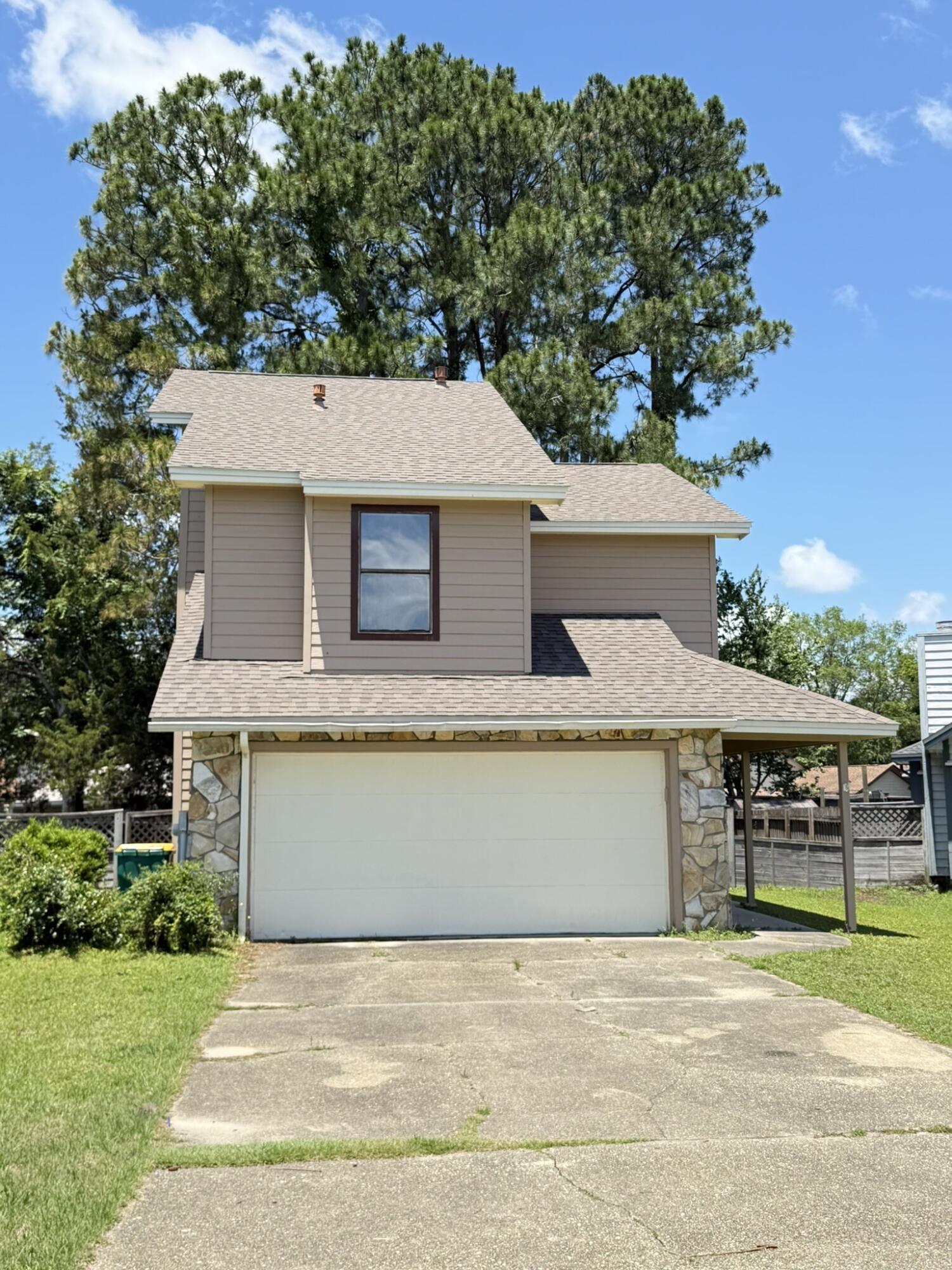 Bank Owned - Located between Eglin AFB and Hurlburt Field, this two-story home offers 3 bedrooms and 2.5 bathrooms in a fantastic neighborhood with convenient access to bases, shopping, and dining. The main level features soaring cathedral ceilings, tile flooring, a cozy fireplace, and an open kitchen with a nearby laundry room. Upstairs you'll find three bedrooms and two full bathrooms, providing comfortable space for family or guests. With a functional layout and great location, this bank-owned property offers a wonderful opportunity to own in a sought-after area. Sold as-is.