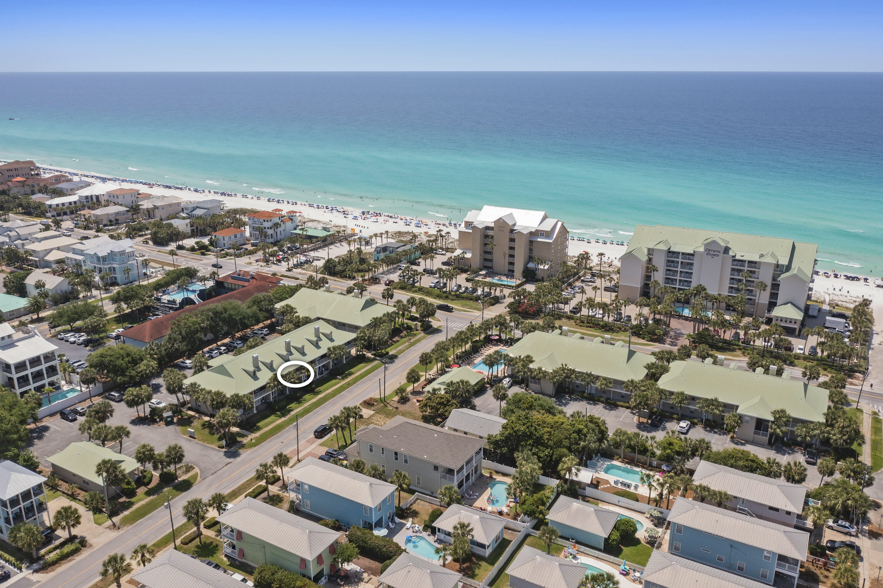 *Over $68,000 in Projected Income for 2026!!* Come see this gorgeously renovated 2BR/2BA unit in the coveted area of Crystal Beach. Located in the Caribbean Dunes complex, enjoy a more private, intimate setting that can't be experienced at crowded resort properties. The 48-unit complex features a community pool, hot tub, and owner's club. Outdoor grills and showers for guest use, as as free on-site parking (golf carts allowed). Situated next to Camille's and only 250 yards to the white sand beaches of Destin, you'll enjoy paradise at it's finest at this 'Guest Favorite' unit. Whether for personal use or for a vacation rental, you can start benefiting immediately with this turnkey unit. Tastefully designed, this property features upgraded kitchen and baths, stylish furniture, and quality essentials for all your guest's needs. Shiplap accent walls, stainless steel appliances, and three 55-65" Smart TV's help provide an elegant, coastal vibe that leave guests smitten. Take in the view of the Gulf from your balcony, which is located just across the street from the pool and hot tub. Situated south of busy Hwy 98, you will appreciate the quiet area, but still reap the benefits of the convenient location. Only 1 mile from Destin Commons, Mid-Bay Bridge, grocery stores, and numerous restaurants and bars. With nearly $50,000 in bookings already on the calendar, 2026 is projected to be a record-setting year. Don't wait on this one! It won't last long! *HVAC 2021, Water Heater 2022; HOA fees $817/mo and include water/sewer, fiber internet, trash, and ground/pool maintenance.*