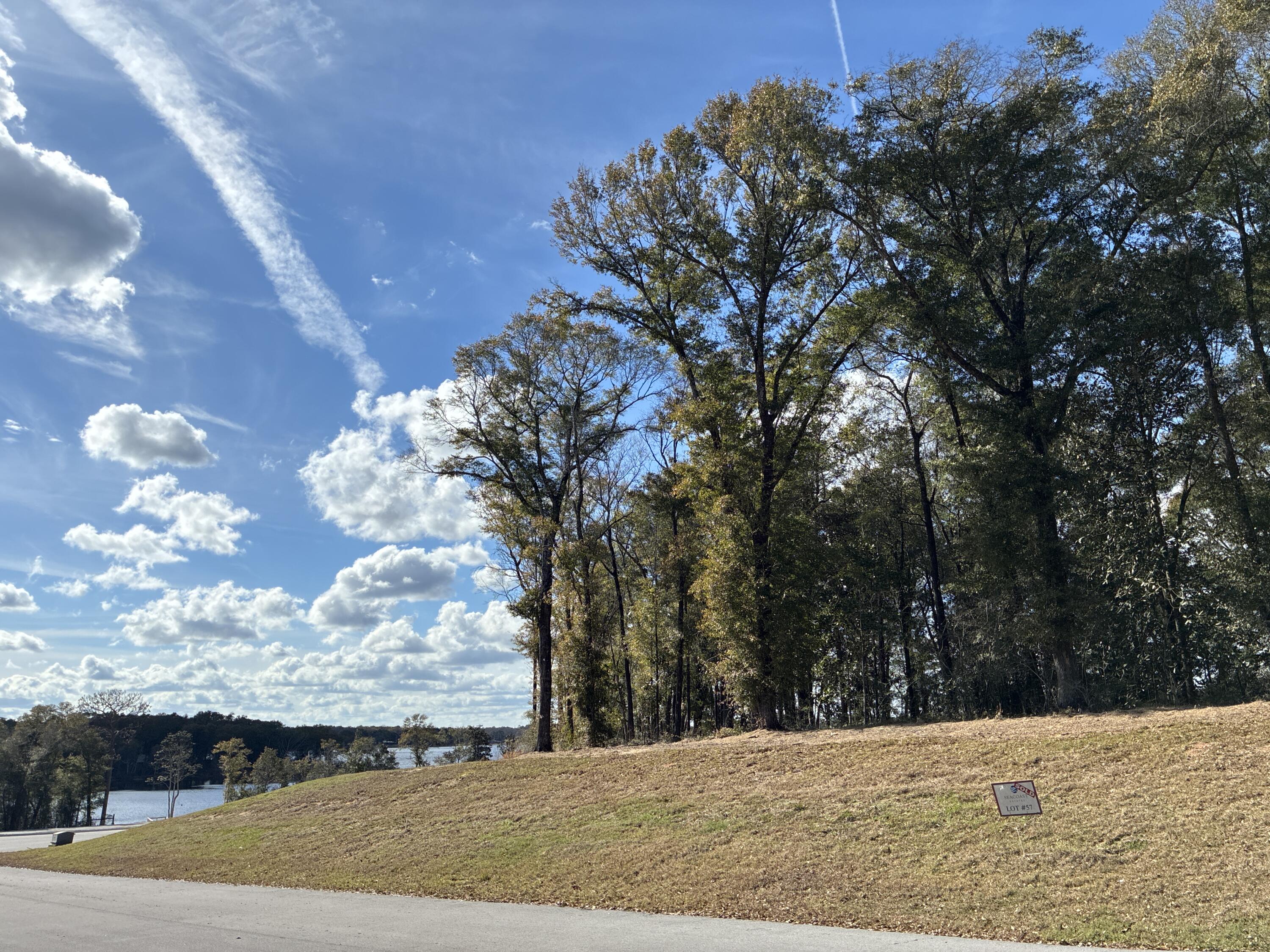 Rare opportunity to own one of the premier lakefront homesites in Seacoast Estates. Perched at a high & dry X Flood zone elevation, Lot 57 offers a rare opportunity to build your dream home on a serene, expansive homesite with some of the most commanding panoramic views of the spring-fed Seacoast Lake. Situated toward the end of the cul-de-sac, this 0.76-acre lot provides a superior vantage point with maximum tranquility and seclusion by comparison. 
Short Term Rental is allowed for the main dwelling. Conveniently located close to I-10 for easy access to the Emerald Coast beaches, Crestview, or Tallahassee.
Enjoy the freedom to build your own private dock and fully enjoy lakefront living. Priced to sell, don't miss this exceptional opportunity!