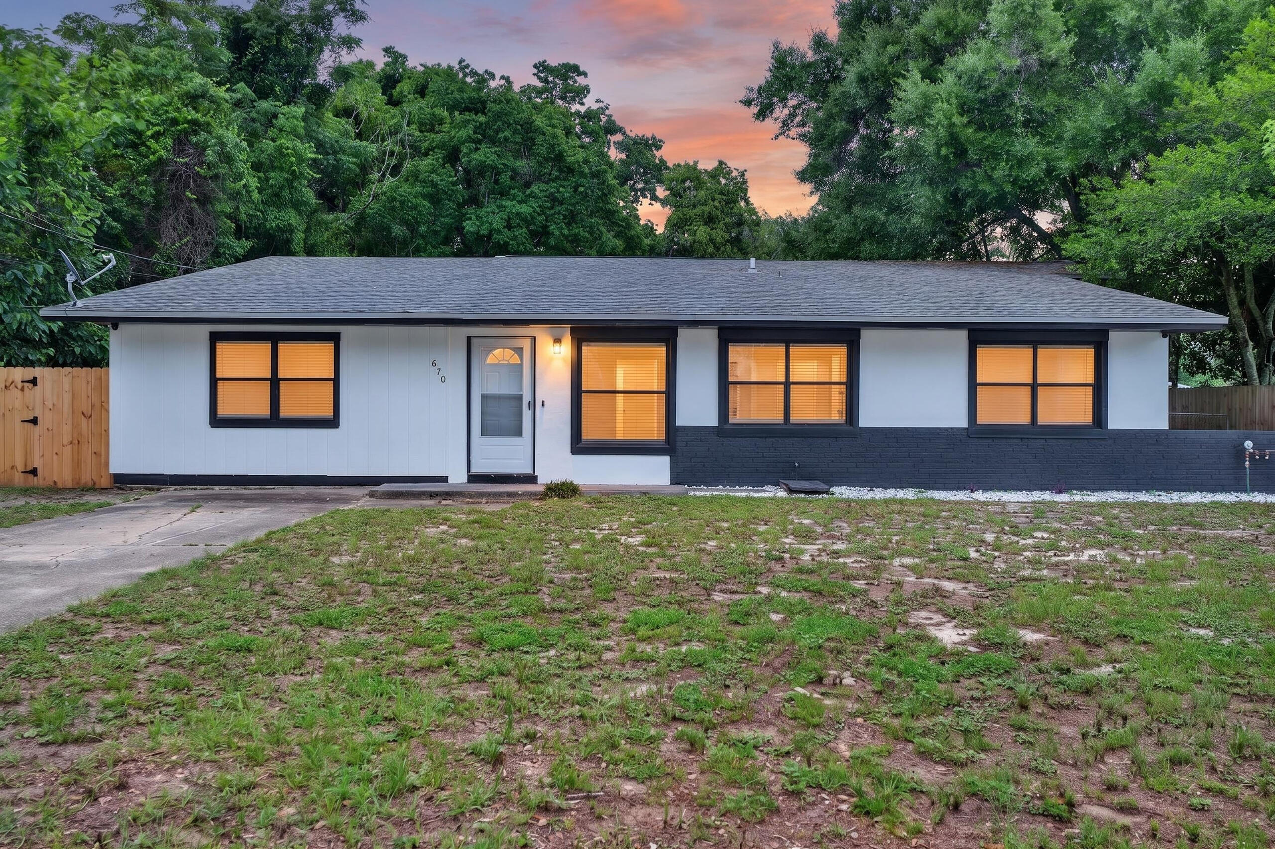 Centrally located in the heart of Fort Walton Beach, this beautifully updated 4-bedroom home offers the perfect blend of style, comfort, and convenience. Just minutes from both Eglin and Hurlburt Field Air Force Bases, this move-in ready property features all new luxury vinyl plank flooring throughout and fully updated bathrooms showcasing sleek flat white tile with striking black tile accents, plus a modern heated mirror for a touch of luxury. The renovated kitchen is designed to impress with hardwood soft-close cabinet doors, elegant quartz countertops, and all new stainless steel appliances. Major systems have already been updated with a 2023 HVAC system and water heater, giving peace of mind for years to come.  Fresh exterior paint adds to the home's curb appeal, while the massive primary suite provides a true retreat with a full-size walk-in closet and private en suite bathroom. With spacious living areas, high-end upgrades, and an unbeatable central location, this home is ready for its next owner to enjoy
