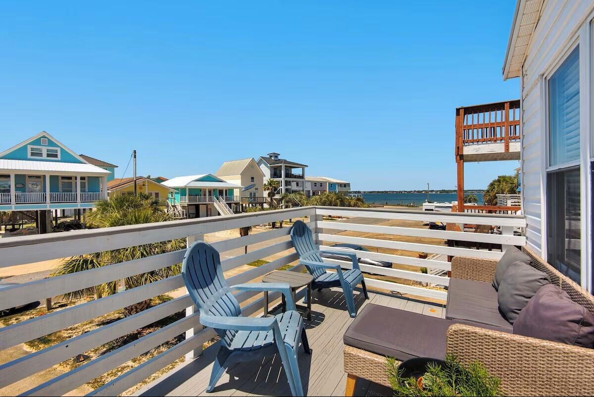 COASTAL LUXURY MEETS INVESTMENT OPPORTUNITY AT NAVARRE BEACH

Rarely does a property come to market that blends luxury coastal living, income-producing potential, and true versatility quite like this one. With a projected annual rental income of approximately +$75,000 ($61,000 in 2026 Bookings to Date), this exceptional Navarre Beach retreat is more than just a home - it is an opportunity to own one of the most unique and strategically designed properties on the island.

The upper level features 3 bedrooms and 2 beautifully appointed bathrooms, thoughtfully designed for comfortable full-time living or an elevated vacation experience. Downstairs offers a completely autonomous 2-bedroom suite with a full kitchenette, creating the ideal setup for short-term rental income, multi-generational living, guest accommodations, or private owner flexibility.

Step outside into your own private coastal oasis where a resort-style pool, expansive entertaining space, and peaceful water views create the perfect backdrop for unforgettable mornings and sunset evenings. Every detail of this property was designed to maximize enjoyment, functionality, and return on investment.

Additional features include an electric vehicle charging station, no HOA restrictions, and the rare freedom and flexibility that discerning buyers are searching for but seldom find at the beach. Whether you are seeking a high-performing investment property, a luxury second home, or a one-of-a-kind primary residence, this is a must-see property that stands apart from anything else currently available on Navarre Beach.