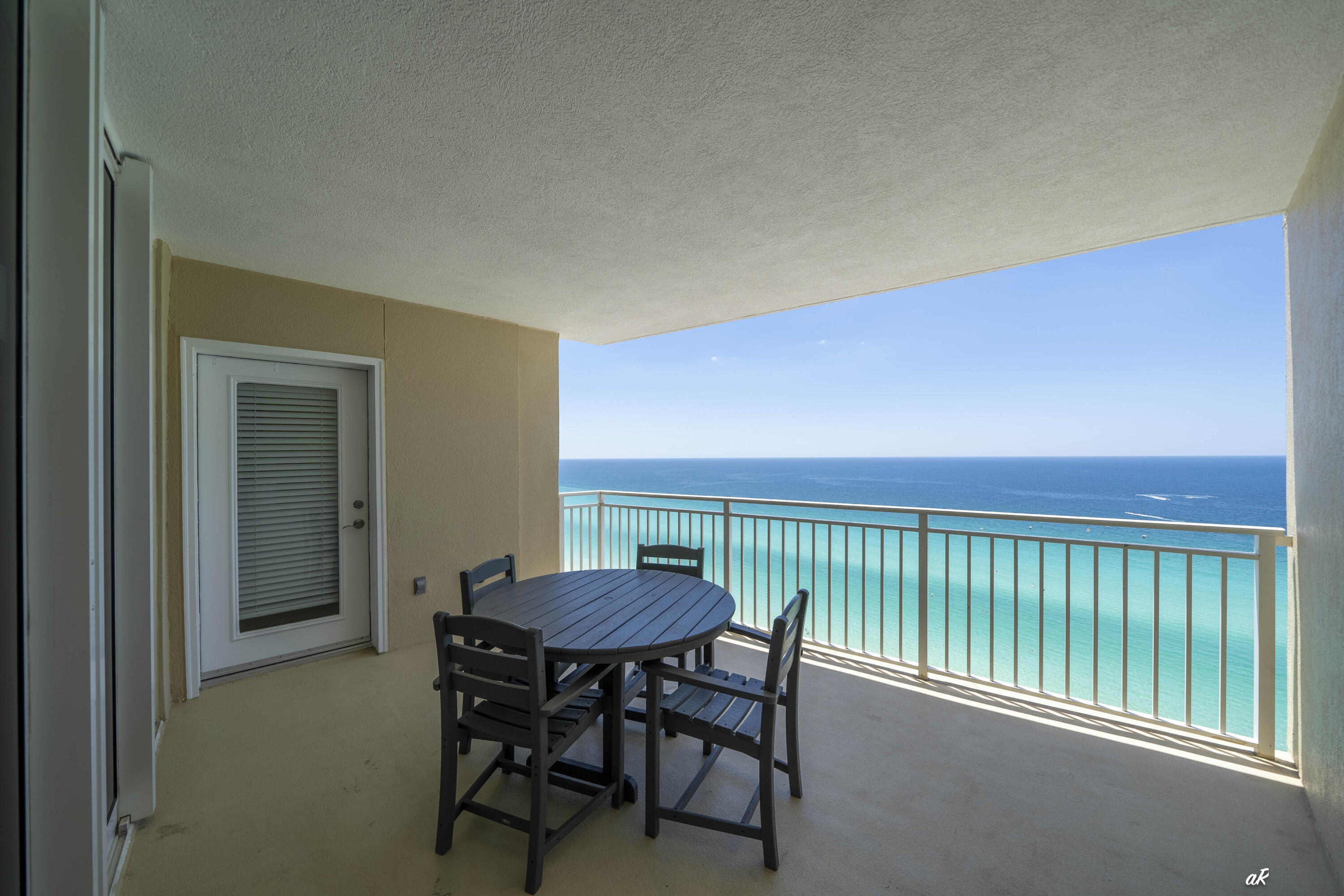 Wake up to panoramic Gulf views from this beautifully maintained beachfront condo at Emerald Beach Resort. This spacious 2-bedroom, 2-bath end unit offers an abundance of natural light thanks to its additional windows and desirable floorplan. With a separate bunk area and sleeper sofa, the condo comfortably accommodates up to eight guests, making it an outstanding opportunity for both personal use and vacation rental income. Pride of ownership shines throughout, as the condo has been meticulously cared for and recently updated with fresh paint and newer carpet. The primary suite features private balcony access, stunning Gulf-front views, and a spacious ensuite bath complete with dual vanities, a soaking tub, and separate walk-in shower. Step outside onto the oversized balcony--one of the largest at the resort--and enjoy endless coastline views, outdoor dining, and unforgettable sunsets. The kitchen is designed for both convenience and entertaining with ample cabinetry, generous counter space, and a breakfast bar overlooking the living area. Additional features include a pantry, laundry room, and plenty of storage throughout. Emerald Beach Resort offers an exceptional lineup of resort amenities including Gulf-front pools, lagoon-style pools, a tiki bar, SkyBar with pedestrian walkover, fitness center, retail shops, grilling areas, game room, and an on-site Starbucks. Covered gated parking, security, and high-speed elevators add even more convenience.  Whether you're searching for a turnkey beachfront getaway, second home, or income-producing investment property, this condo offers the ideal combination of location, comfort, and coastal lifestyle.