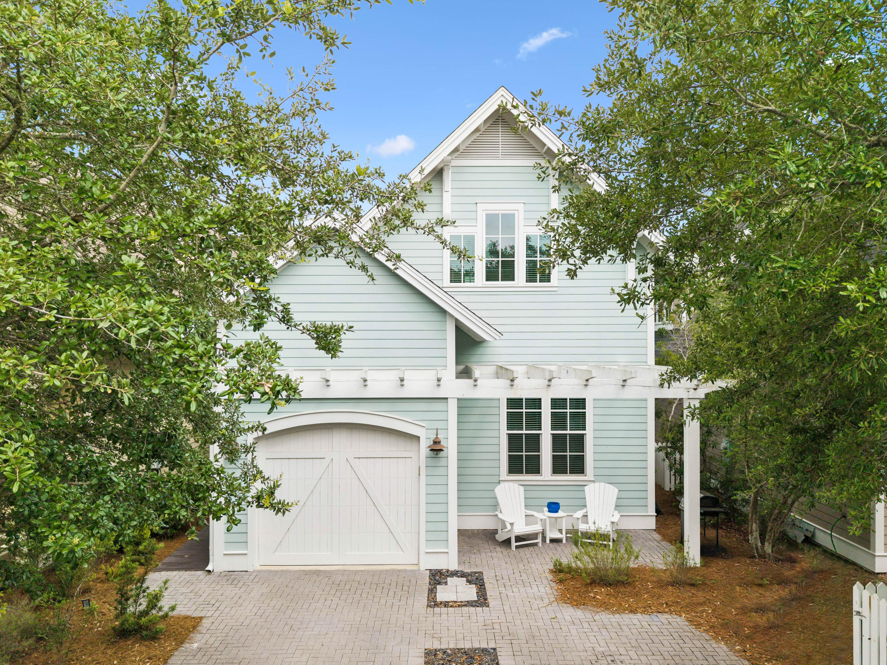 Beautiful coastal cottage just steps from Watersound West Beach's private beach access and resort-style amenities.

Located south of Scenic Highway 30A and bordered by Deer Lake State Park, 26 Full Moon Lane offers 2 suites, a guest bedroom, bunk room, flex space, screened porch, outdoor shower, and one-car garage. The open main level features hardwood floors, a gourmet kitchen with upgraded cabinetry, stainless appliances, granite island, and a first-floor primary suite.

Upstairs includes a second suite, guest bedroom with adjoining bath, built-in bunk room, and flex space for an office, media area, or extra sleeping. Enjoy community boardwalks, heated pool, clubhouse, grilling areas, and private beach access--ideal as a primary home, second home, or vacation rental.