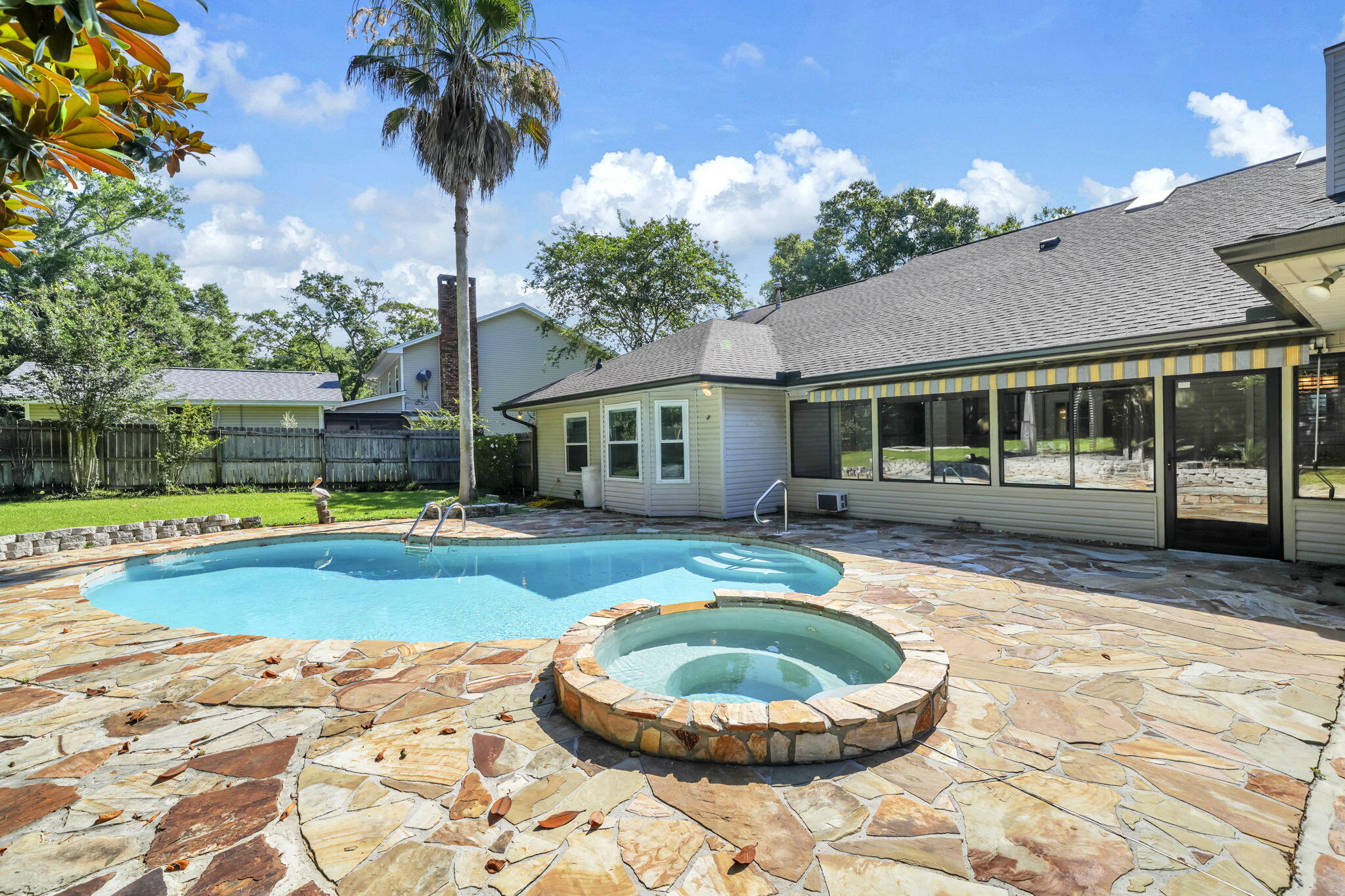 Rarely available in Niceville, this pool and spa home features two primary suites, a private backyard retreat, no HOA, and is located just 15 minutes from the sugar-white sands of Henderson Beach State Park. Tucked beneath a canopy of mature oak trees, this spacious single-level home offers the space, privacy, and flexibility that today's buyers are searching for.
Inside, vaulted ceilings, skylights, hardwood floors, and a dramatic floor-to-ceiling brick fireplace create a warm and welcoming gathering space. The kitchen offers granite countertops, a gas range, abundant cabinetry, and views of the backyard so you're never far from the action. The rare dual-primary-suite floor plan provides options for multigenerational living, extended guests, or simply giving everyone a little extra room to spread out.
Step outside and enjoy your own private Florida getaway. The screened porch overlooks the pool and spa, while the fenced backyard offers plenty of room to relax, entertain, and enjoy life outdoors. You'll also appreciate the two detached outbuildings, including one with power, providing additional space for a workshop, studio, hobbies, storage, or future projects.
With no HOA, a large homesite, mature oak trees, dual primary suites, and a backyard designed for making memories, this property offers a combination of features that is becoming increasingly difficult to find in Niceville. From pool days at home to beach days on the Gulf, this is Florida living at its best. of Northwest Florida's most desirable places to call home.