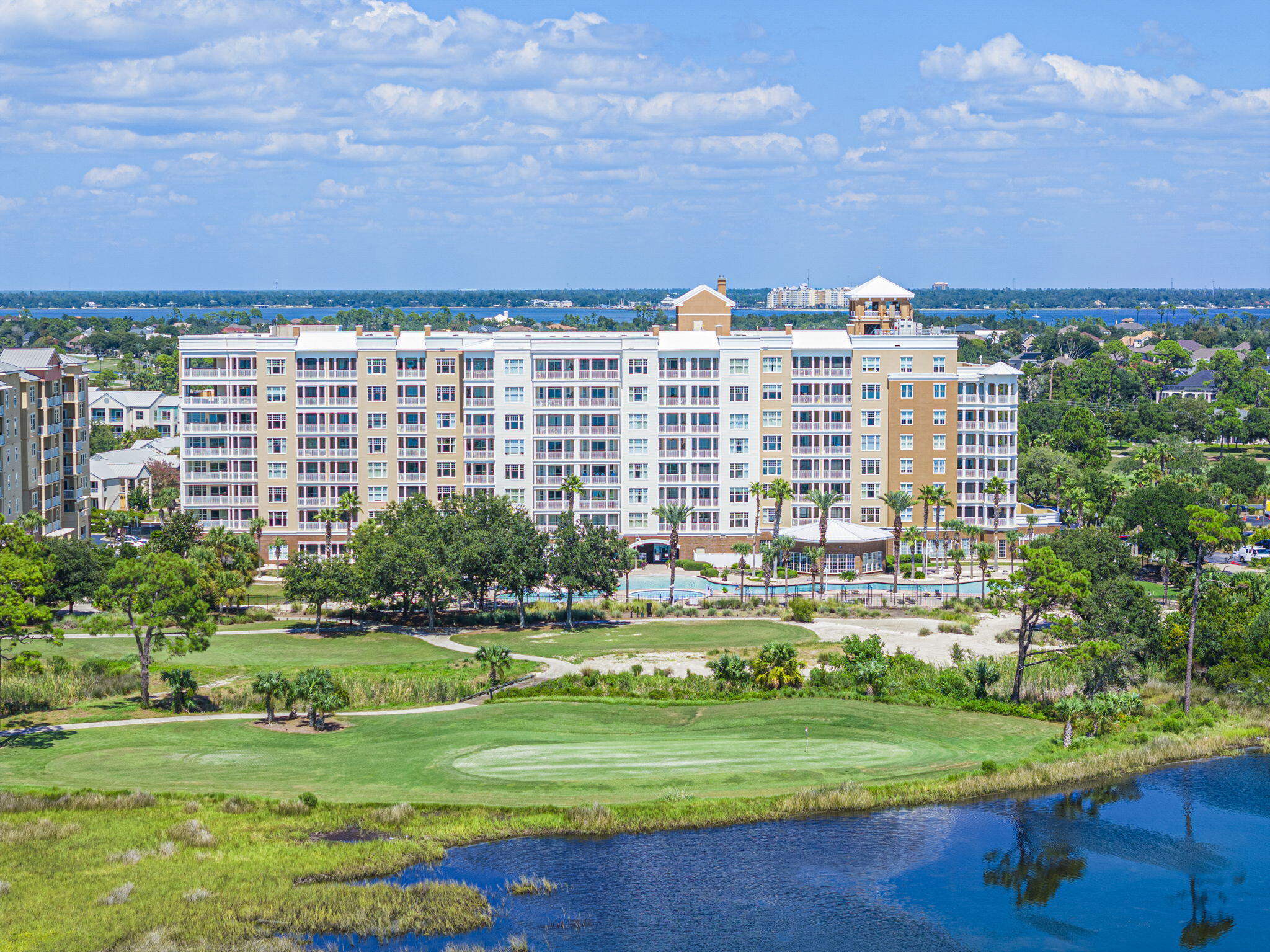 Welcome to Reflections at Bay Point, one of Panama City Beach's premier luxury resort communities offering the perfect blend of refined coastal living and resort-style amenities. Whether you're searching for a full-time residence, second home, or investment property with short-term rental potential, this beautifully updated 2-bedroom, 2-bath condo is truly turnkey and ready to impress. Located on the convenient first floor, this immaculate unit has undergone over $66,000 in upgrades and renovations. Interior features include LifeProof LVP flooring throughout, crown molding, custom shutters, designer remote-control ceiling fans with lighting, new baseboards, fresh floor-to-ceiling paint including trim and doors, a custom Ruvati sink, Kohler commercial faucet, and Samsung stainless steel appliances, including a smart refrigerator with internet access. Additional updates include newer AC coils and a hot water heater, both less than four years old. Step into a lifestyle surrounded by breathtaking sunrises and sunsets, dolphins playing in the bay, herons along the shoreline, and views of golfers enjoying the signature fifth hole of the only Nicklaus Course in Northwest Florida. Reflections offers exceptional amenities including a 10,000-square-foot tropical resort-style pool, seasonally heated pool, hot tub, fire pit, grilling stations, tennis courts, and lush tropical landscaping throughout the property.  Just steps away at Bluegreen Vacations Bayside Resort, you'll enjoy multiple dining options including Cabana Café, Flip Flop's, Tides Restaurant & Lounge, and Pelican's. Outdoor enthusiasts will love the nearby Paradise Adventures kiosk offering watersport rentals, private charters, Shell Island shuttles, and adventure tours right from the marina pathway. If you've been dreaming of a luxury coastal retreat with incredible amenities, strong rental potential, and an unbeatable Bay Point location, this stunning condo checks all the boxes. Schedule your private showing today and start enjoying the Northwest Florida lifestyle you deserve