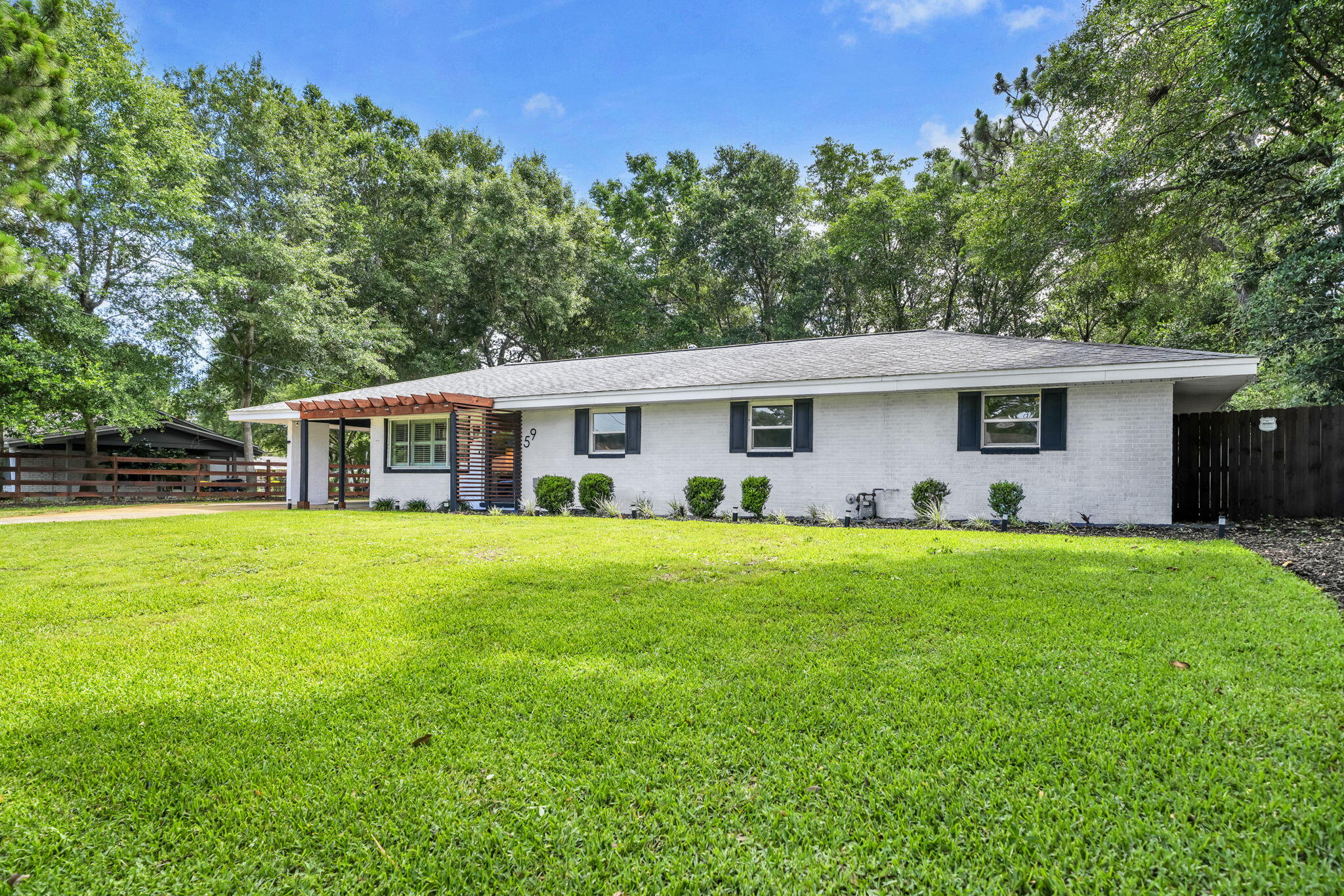 Welcome home! This beautifully updated, all-brick, move-in-ready single-story residence features 4 spacious bedrooms, a dedicated office (simply add a closet to create a 5th bedroom), and 2.5 bathrooms.
The hall bathroom was thoughtfully enlarged and completely remodeled in 2023. 
Situated on a large, fully fenced lot with a park-like backyard setting, this home is located just one block from Ferry Park, offering walking trails, frisbee golf, tennis courts, pickleball courts, and family-friendly recreation. It's also conveniently located next to Elliot Point Elementary School.
Nestled in a well-established neighborhood, you'll enjoy easy access to Uptown Station, the Fort Walton Yacht Club, and the vibrant downtown Fort Walton Beach area, known for its restaurants, coffee shops, farmers market held every other Saturday, and frequent community events at the newly rebuilt waterfront pavilion.
The heart of the home is the beautifully updated kitchen, featuring a custom island installed in October 2023 with granite countertops, built-in electrical outlets, and abundant storage. Additional upgrades include an oversized built-in stainless steel KitchenAid refrigerator (valued at $6,000) with an integrated pantry and custom sliding shelves for easy access, a stainless steel Samsung dishwasher, a premium stainless steel ZLINE gas range (valued at $2,400), a water filtration system, and a new Kohler faucet.
Throughout the home, you'll find new light fixtures and ceiling fans with remote controls, new windows in the front bedrooms, and three large new windows installed in the primary bedroom in April 2026. One bedroom features a custom closet system installed in October 2023, creating the closet of your dreams. The system conveys with the home and can easily be removed to suit the next owner's needs.
Custom feature walls in both the living room and primary bedroom add warmth, character, and style. The interior has also been freshly painted, creating a bright and welcoming atmosphere.
Outdoor improvements are equally impressive. The storage shed nearest the home was completely rebuilt from the studs up and now features custom French doors, providing ample space for tools, bicycles, paddleboards, and even a motorcycle. The red backyard shed received new Trex decking in May 2024 and also conveys with the property.
The backyard is designed for relaxation and entertaining, featuring a fire pit and a screened 10' x 12' gazebo that conveys with the home. Additional exterior upgrades include:
" Lime-washed brick completed in October 2023, allowing the brick to breathe naturally
" New water heater installed in 2024
" Custom pergola added in January 2024 to protect the new living room picture window
" New custom mailbox
" Decorative side-yard fencing with solar lighting
" New storm/screen front door

A newer LG ThinQ washer and dryer are negotiable.
With over $80,000 in improvements, all the hard work has already been done. Simply move in and start enjoying your new home. You'll also appreciate the exceptional neighborhood atmosphere, with many neighbors having lived in their homes for 30 years or more.
This established community offers close proximity to Eglin Air Force Base, shopping, dining, outdoor activities, and convenient water access.
Don't miss your opportunity to make this exceptional home yours today.