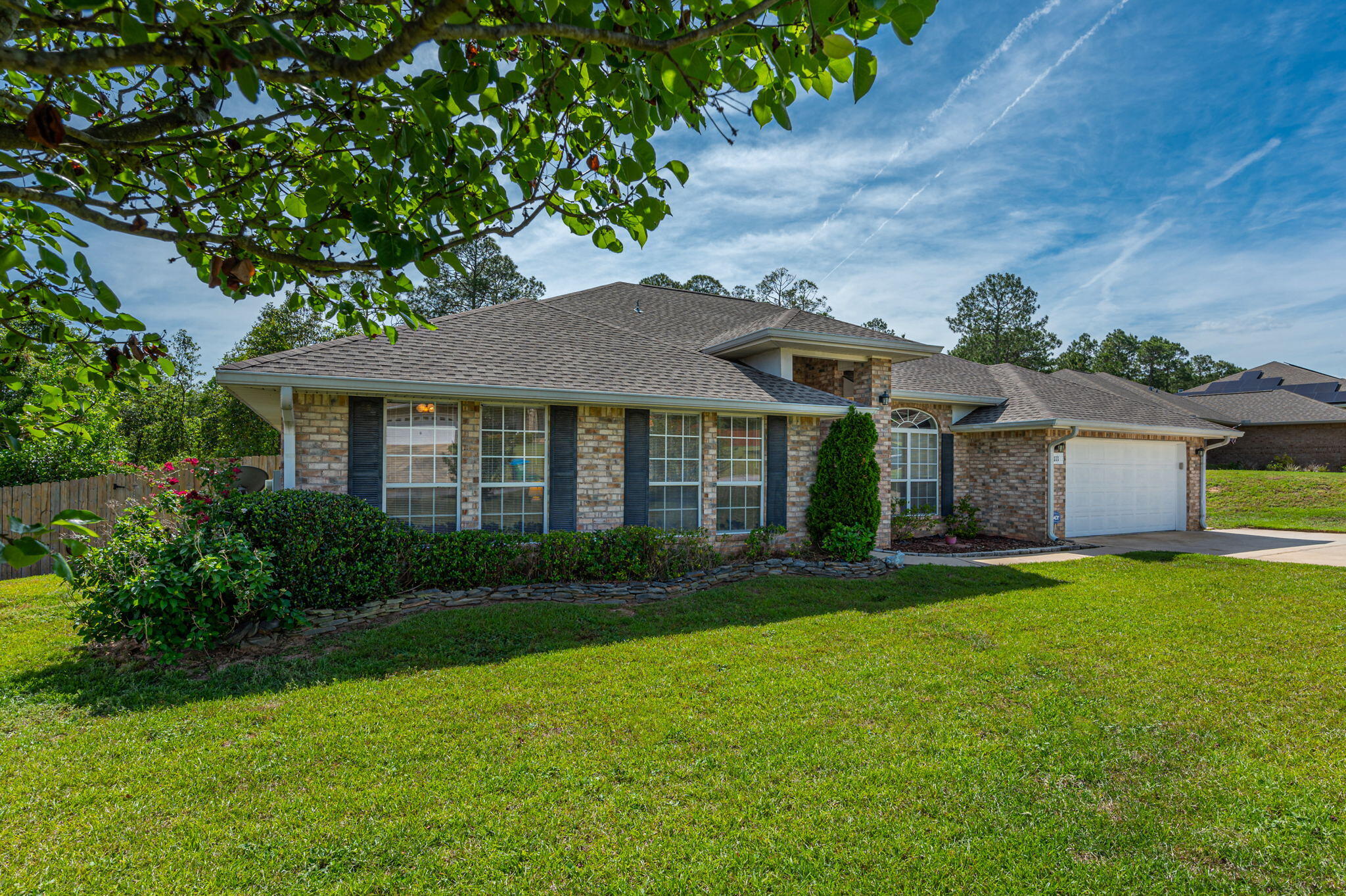 If you need a home with plenty of space you won't want to miss out on this one!  Upon entering the home you are greeted with tiled floor, living room, and a large family room.  This kitchen has more counter space and cabinets than you will know what to do with.  There is also a plentiful amount of pantry space which leads into the laundry room.  This home has a new roof 2021 and newer AC unit 2019.  If convenience is important to you, we can satisfy that need as well.  Located south of I-10, convenient to military bases and a quick drive to the white sandy beaches of the beautiful Emerald Coast.  Drapery and hardware do not convey